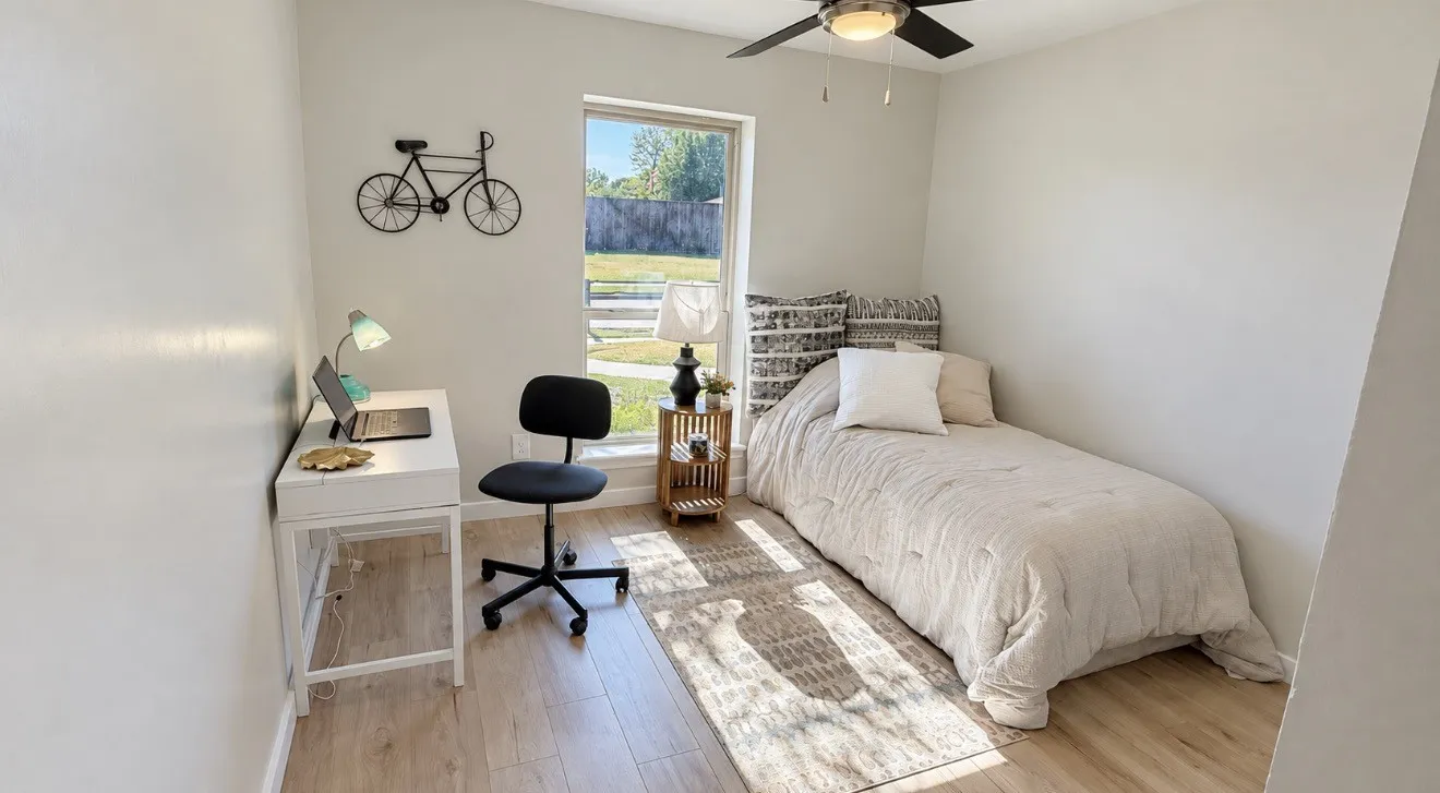 Recessed window offering natural illumination, light laminated-finish flooring, and a ceiling fan with integrated lighting