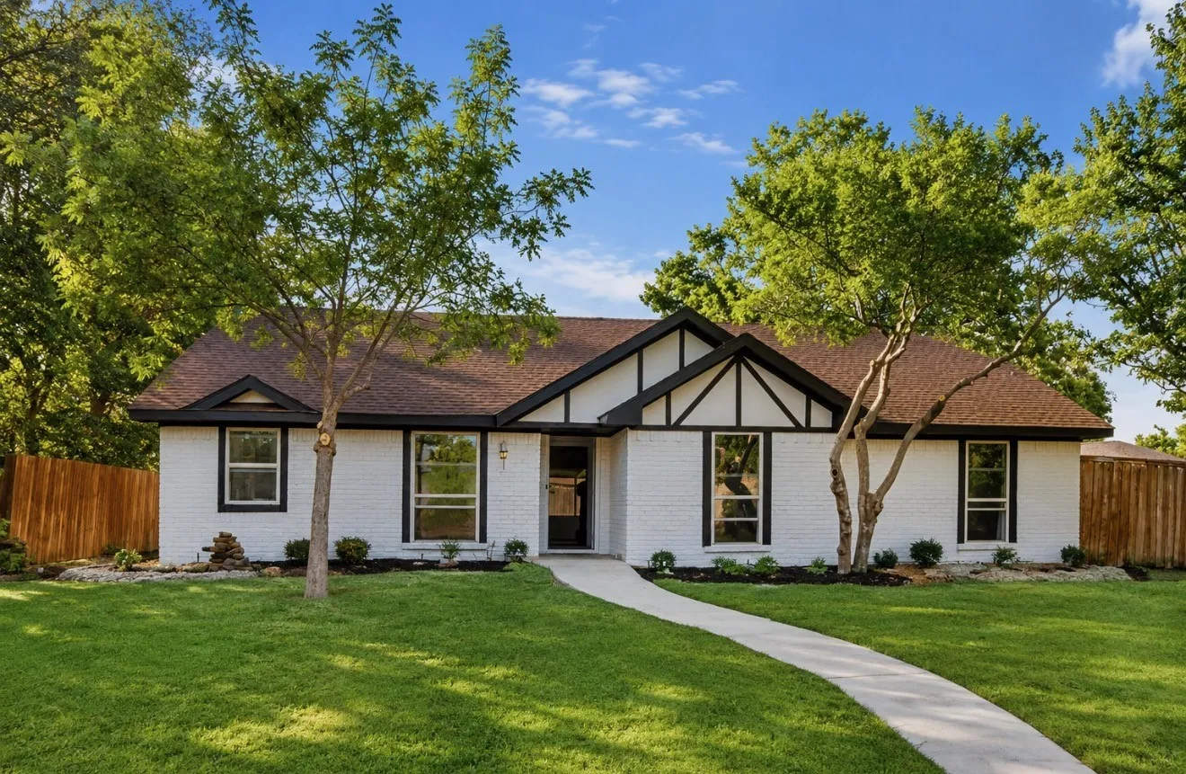 White brick exterior with dark trim accents
