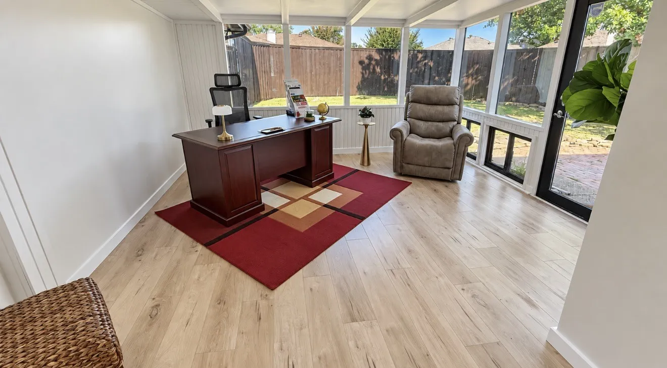 Sunroom / Multi purpose room, featuring light Laminate-finish flooring, white paneled walls, and expansive windows