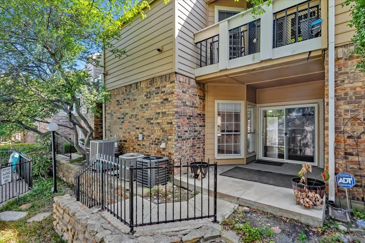 Back patio with walkway to community pool