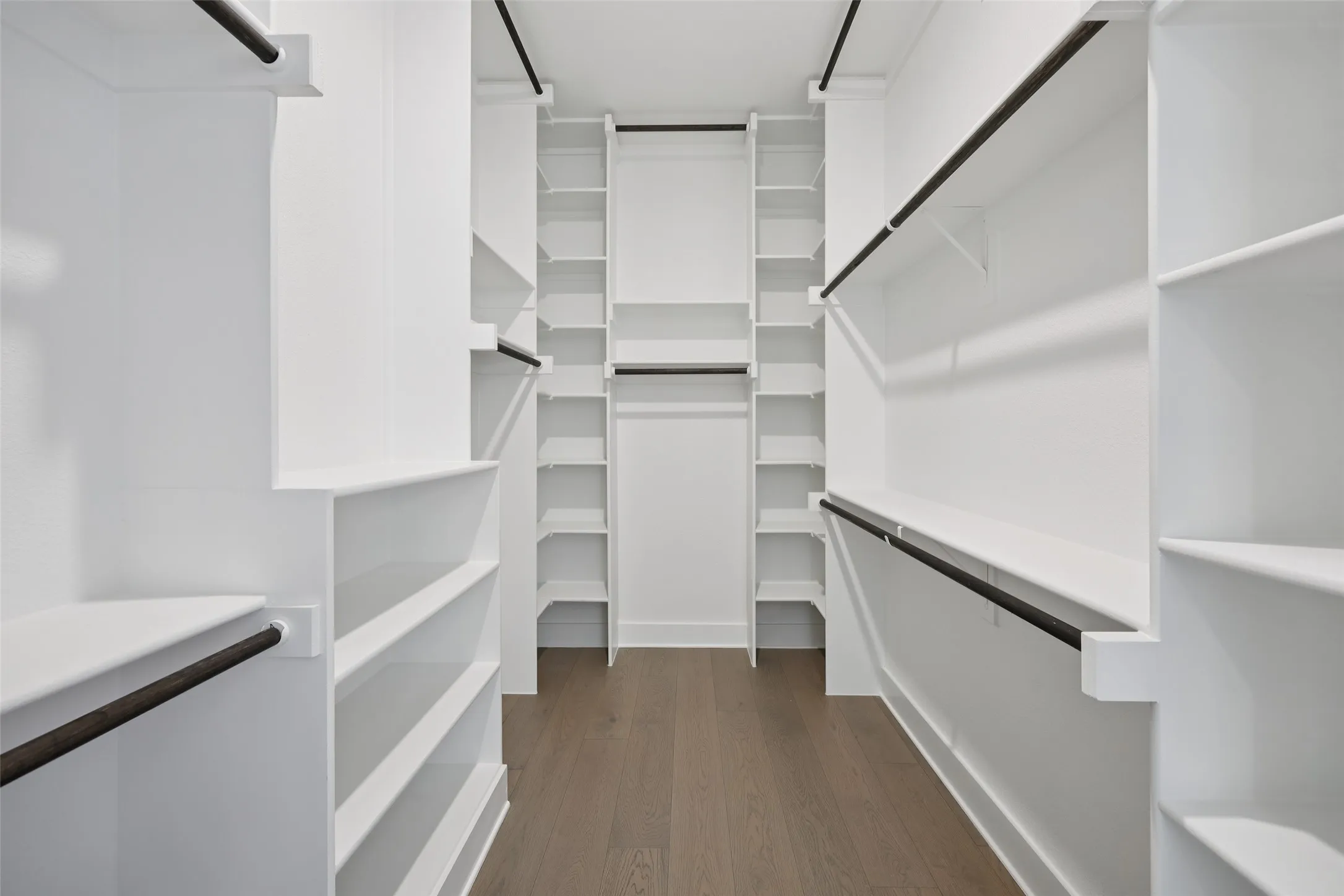 Primary bedroom oversized walk-in closet.