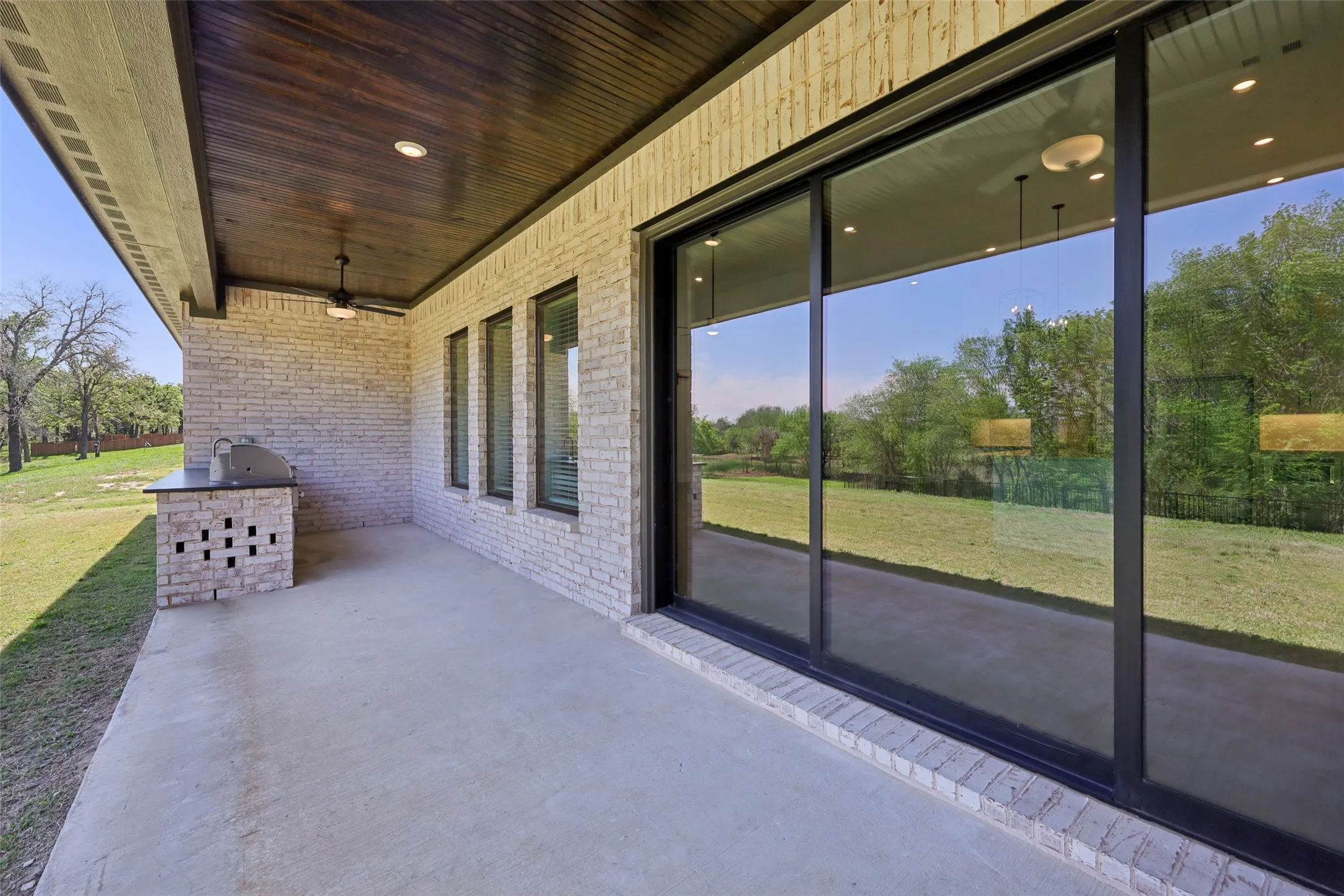 An example of the beautiful Mantle floor plan built at 132 Peachleaf Drive with an outdoor kitchen and covered patio.