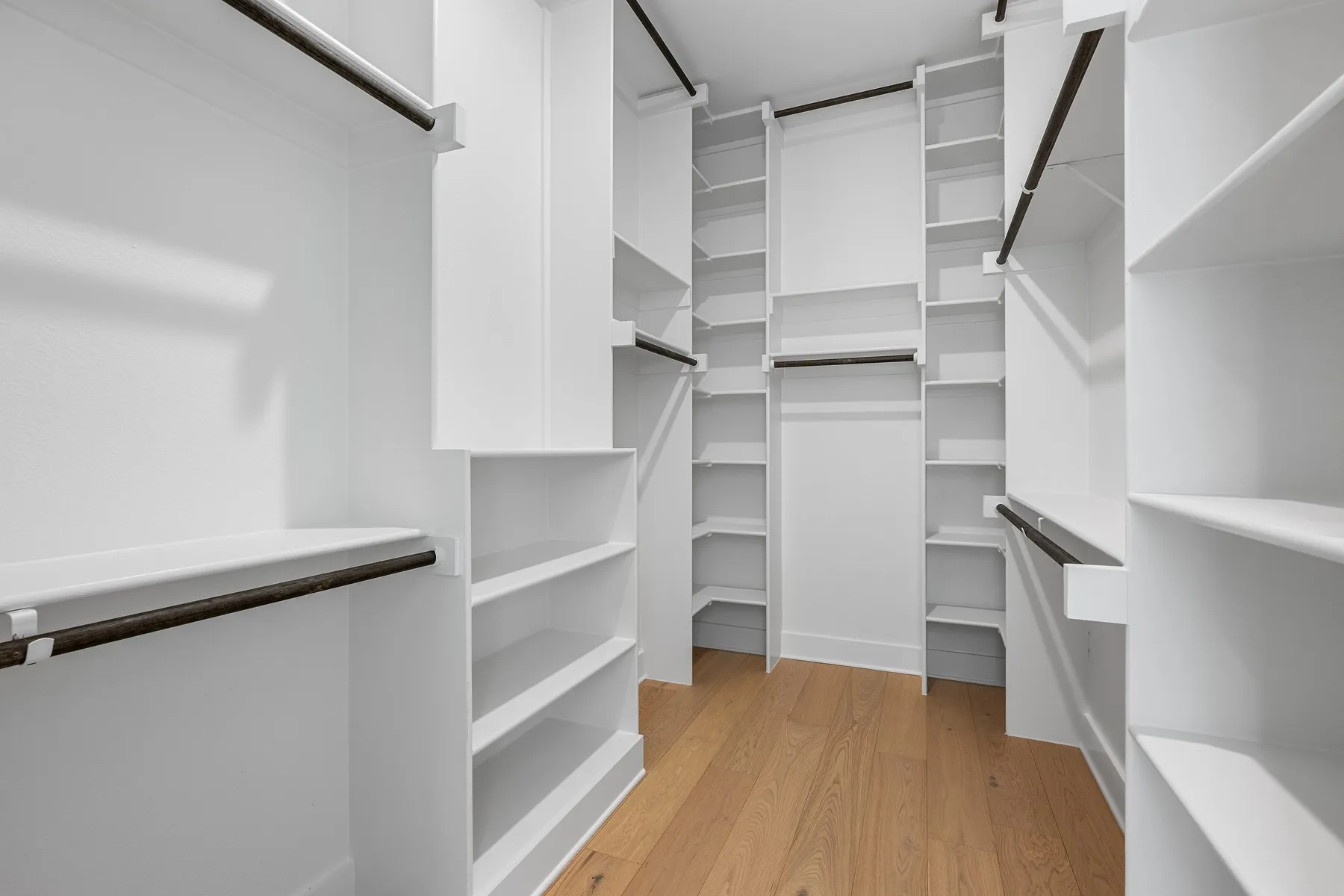 Primary bedroom walk-in closet.
