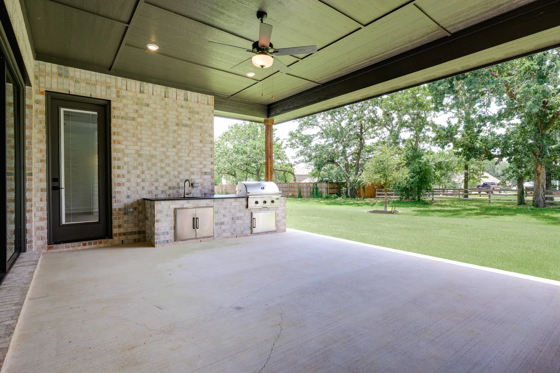 The outdoor kitchen and covered patio come standard.