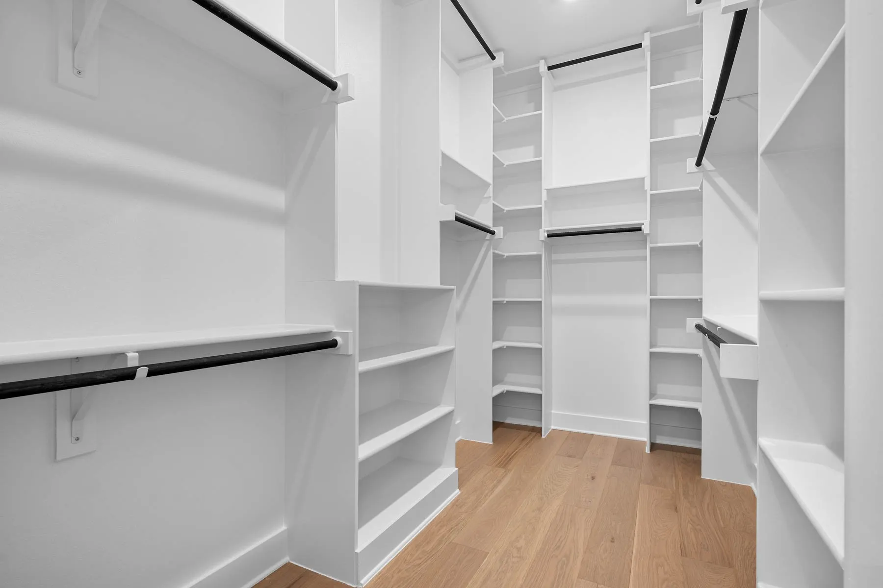 One of the walk-in closets in the primary bedroom.