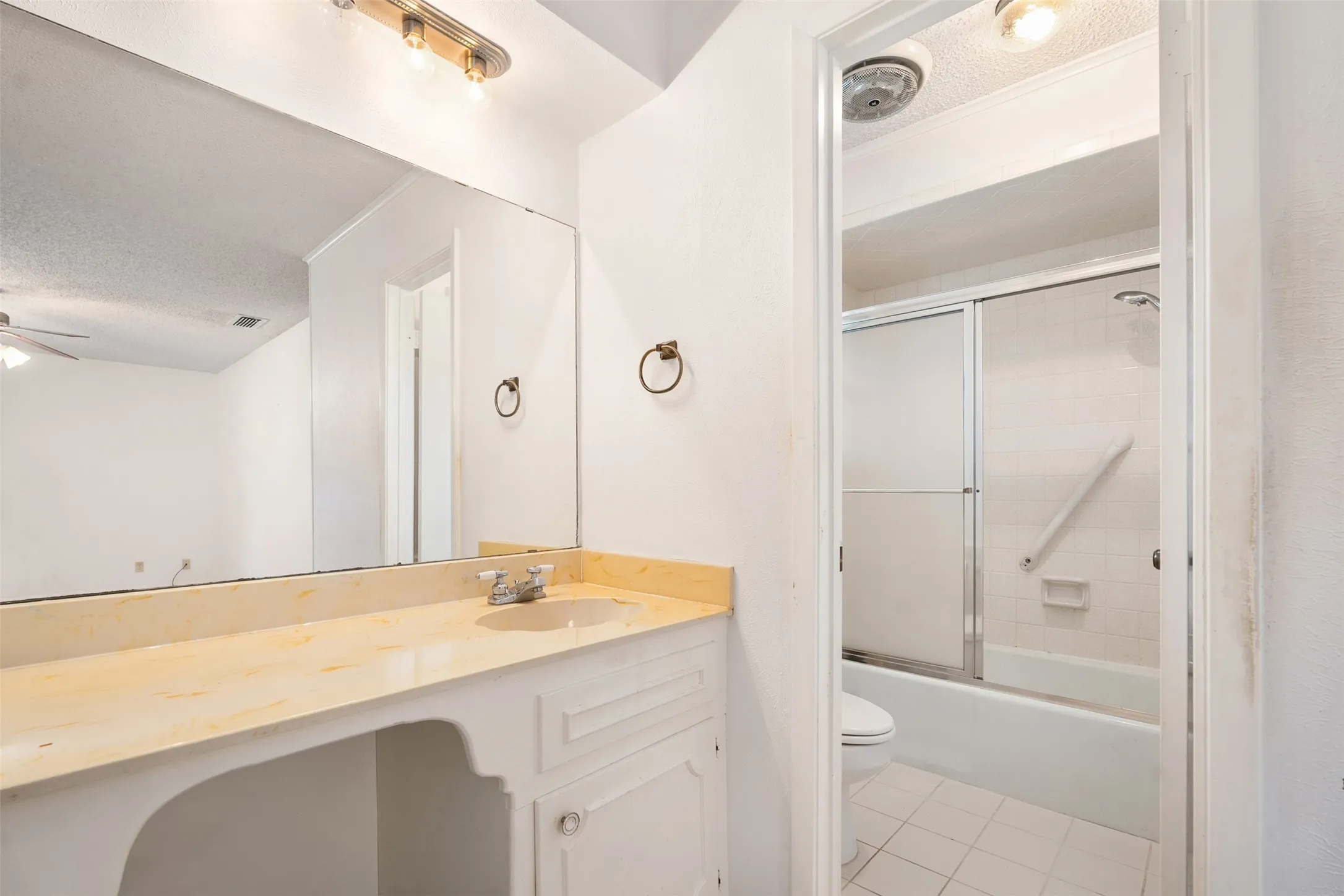 Primary bathroom with tub and shower combo