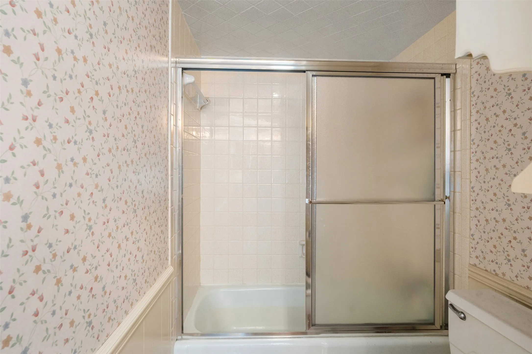 Hall bathroom with tub and shower combo