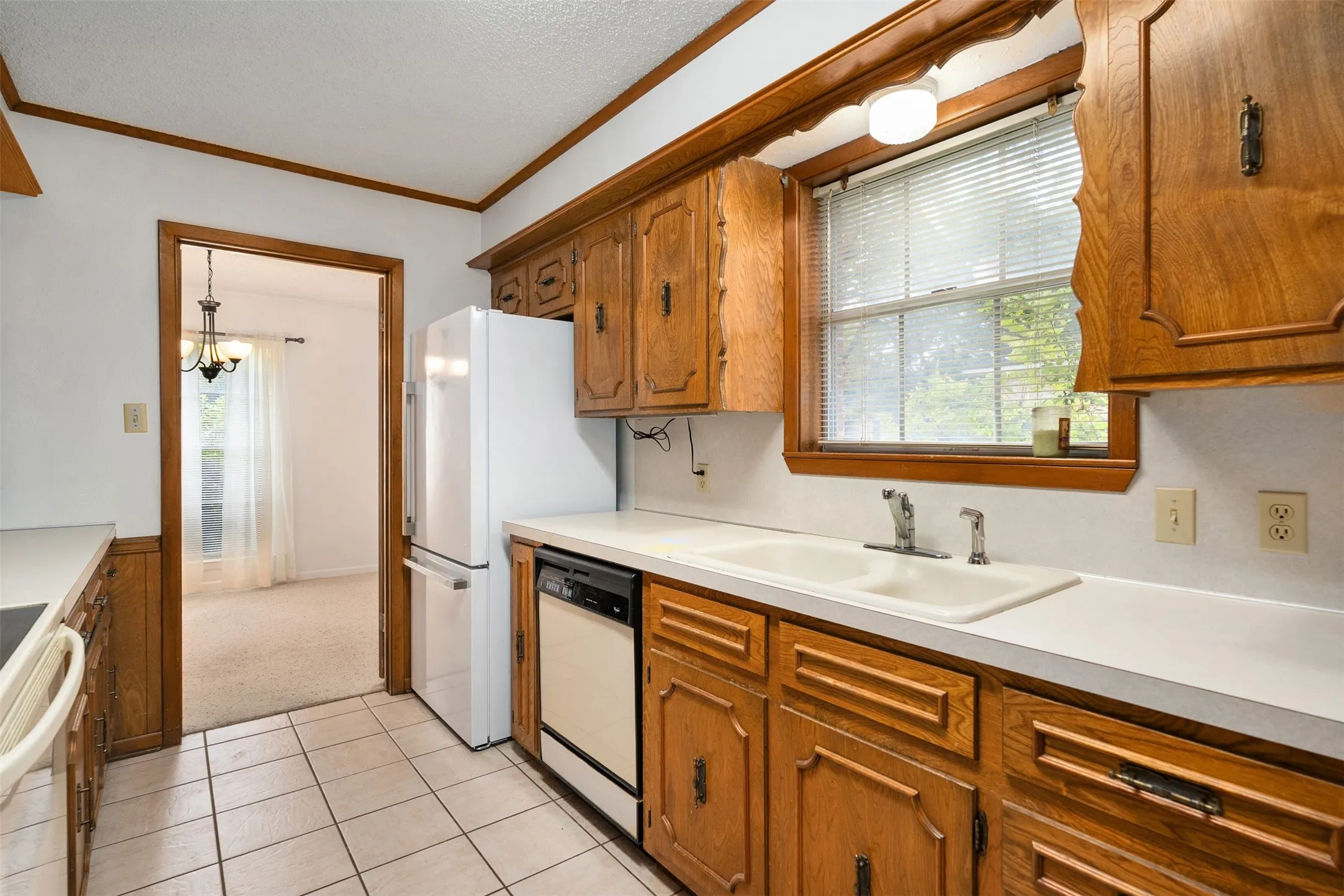 Kitchen including dishwasher, refrigerator, range and microwave