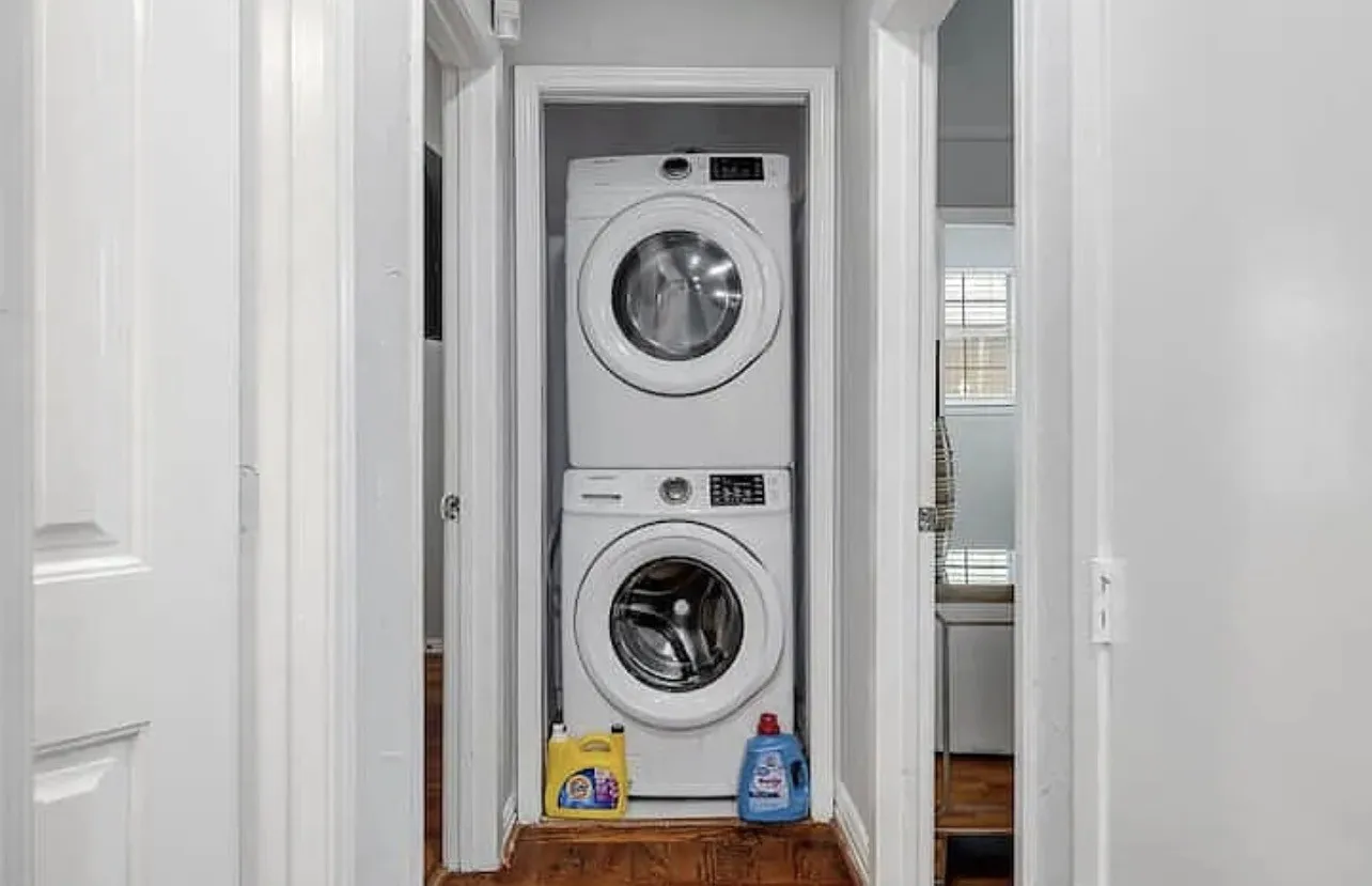 Stacked washer and dryer unit, wood-finish flooring