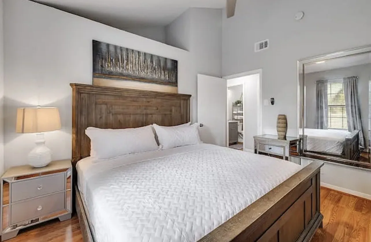 Wood-finish flooring, vaulted ceiling, and recessed lighting