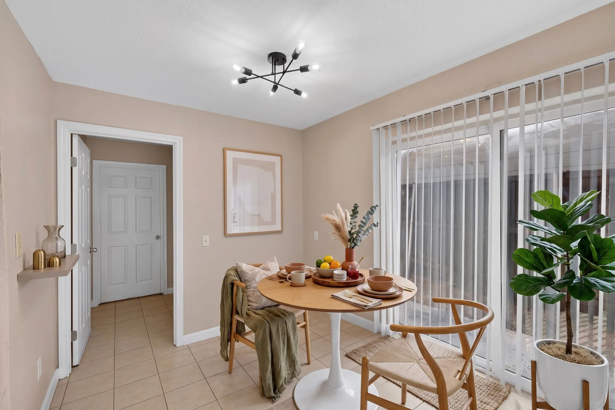 Recessed lighting, tile flooring, modern black-finish ceiling fixture, sliding glass doors, and a built-in wall shelf