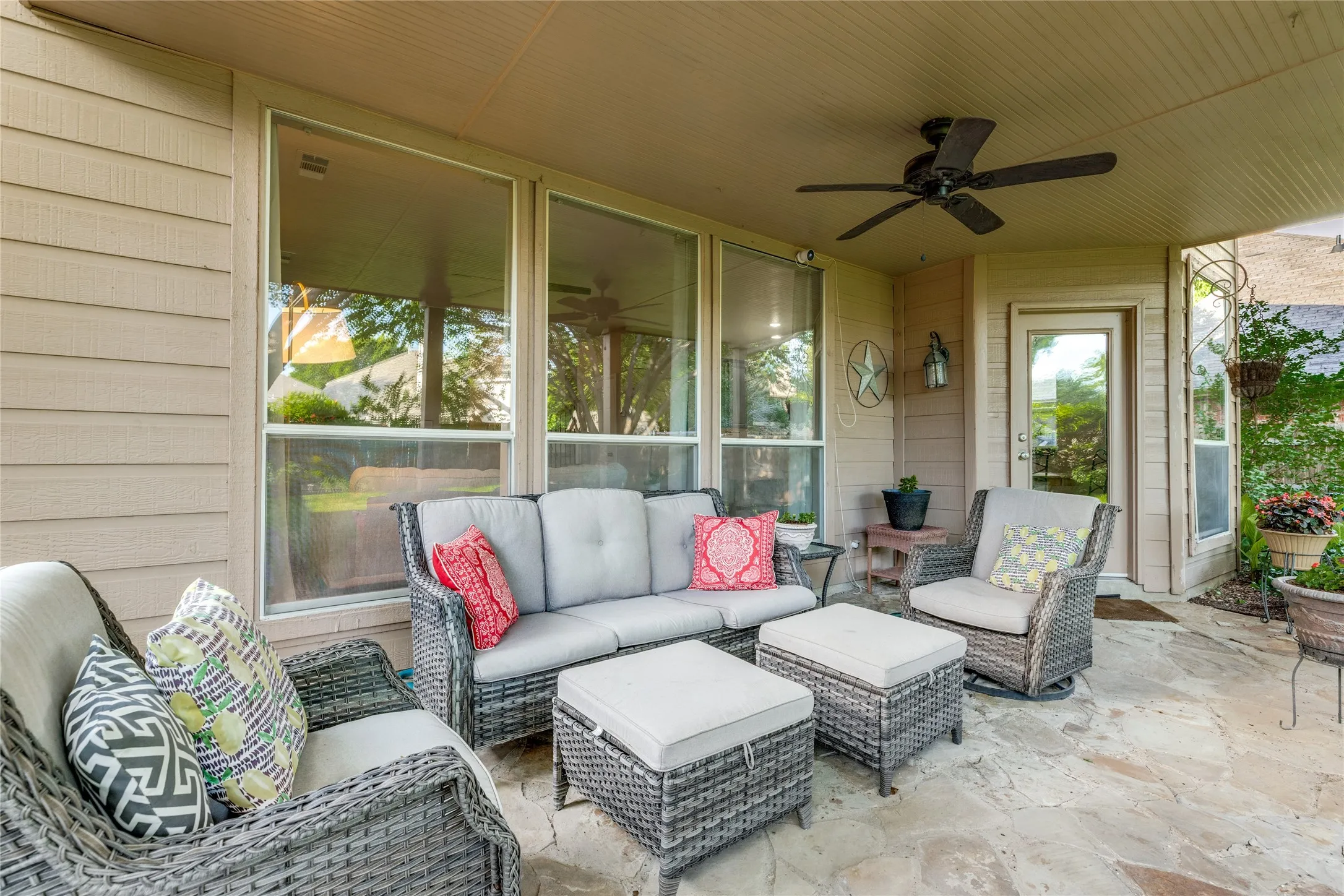 The covered patio looks over the spacious backyard.