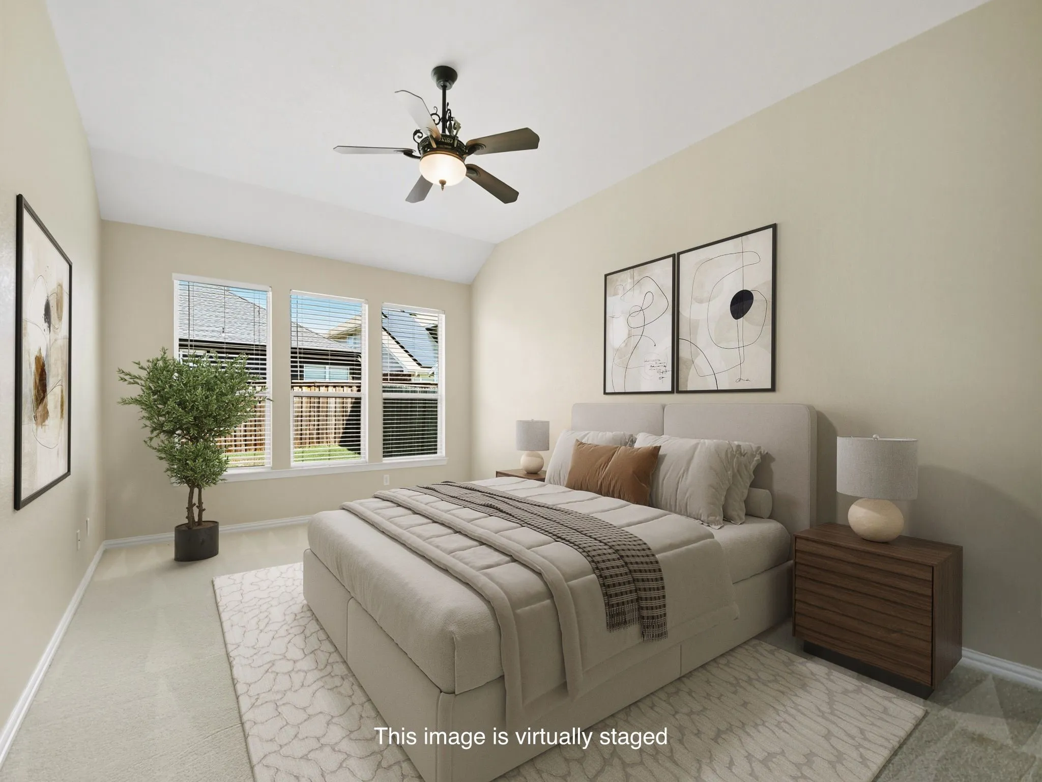 Primary Bedroom w Vaulted ceiling with a ceiling fan, three large windows, neutral-toned walls, and soft carpet flooring