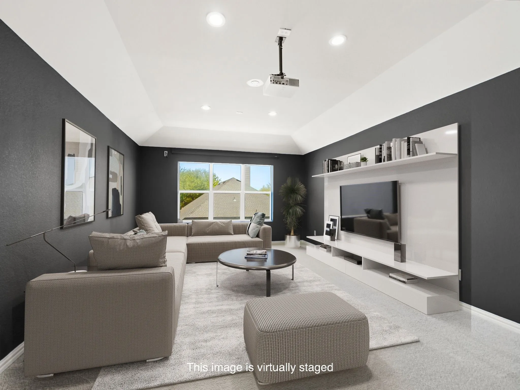 Media room w vaulted ceiling with recessed lighting