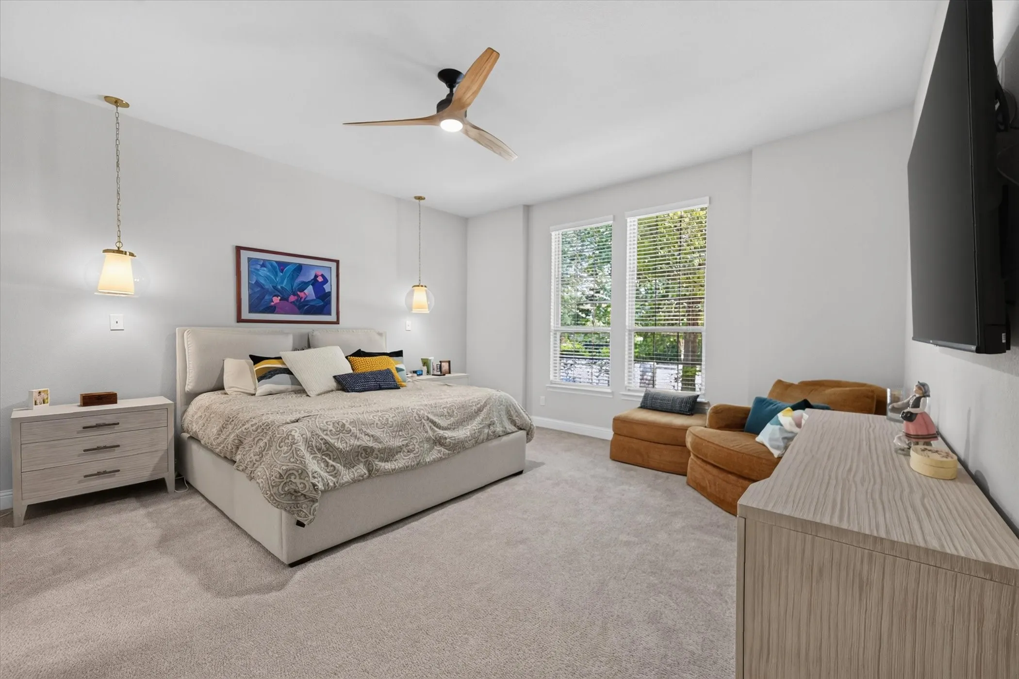 Recessed lighting, wood-finish ceiling fan, pendant lighting, carpet flooring, and dual windows