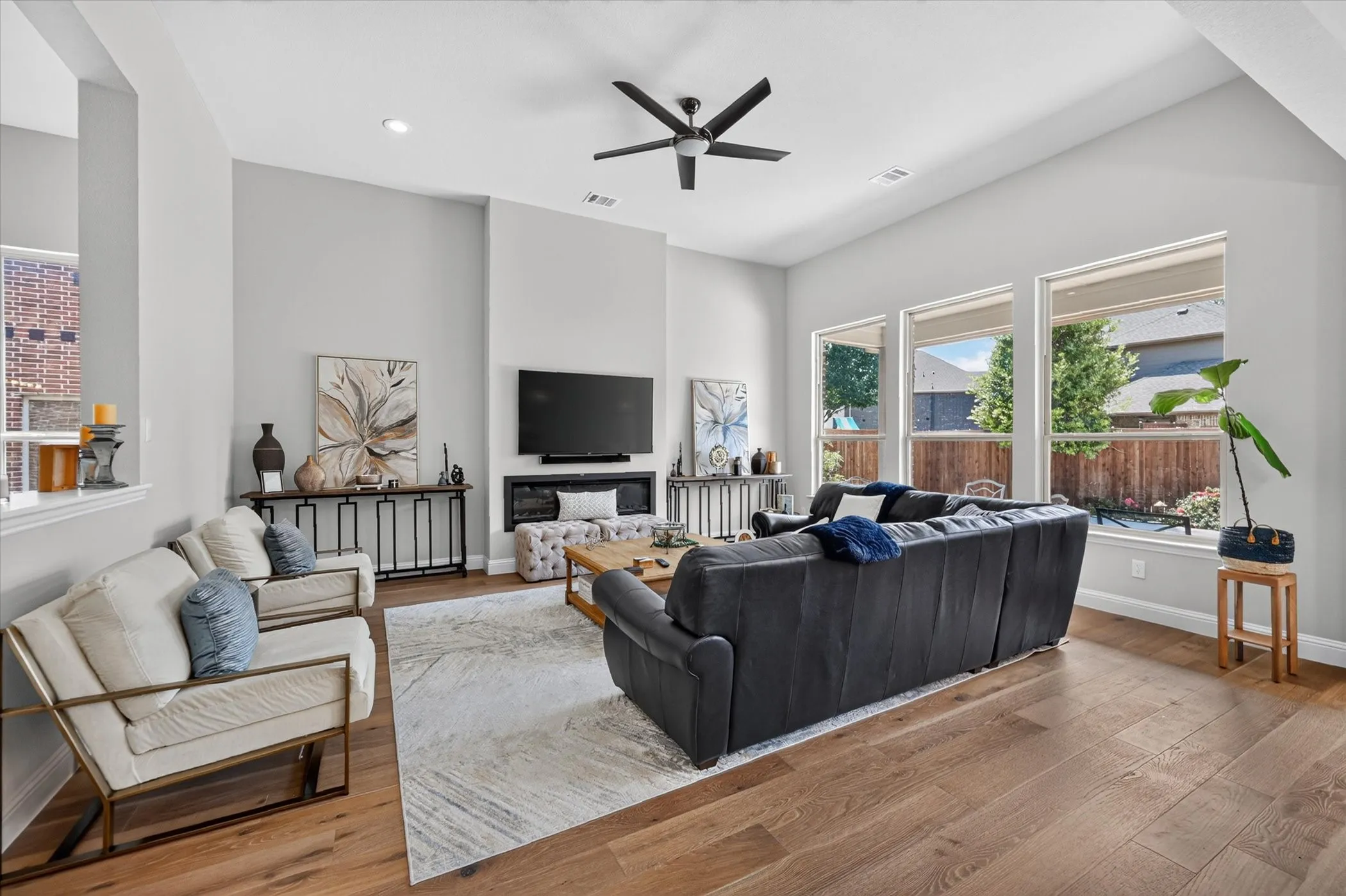 Vaulted ceilings complement the wood-finish flooring