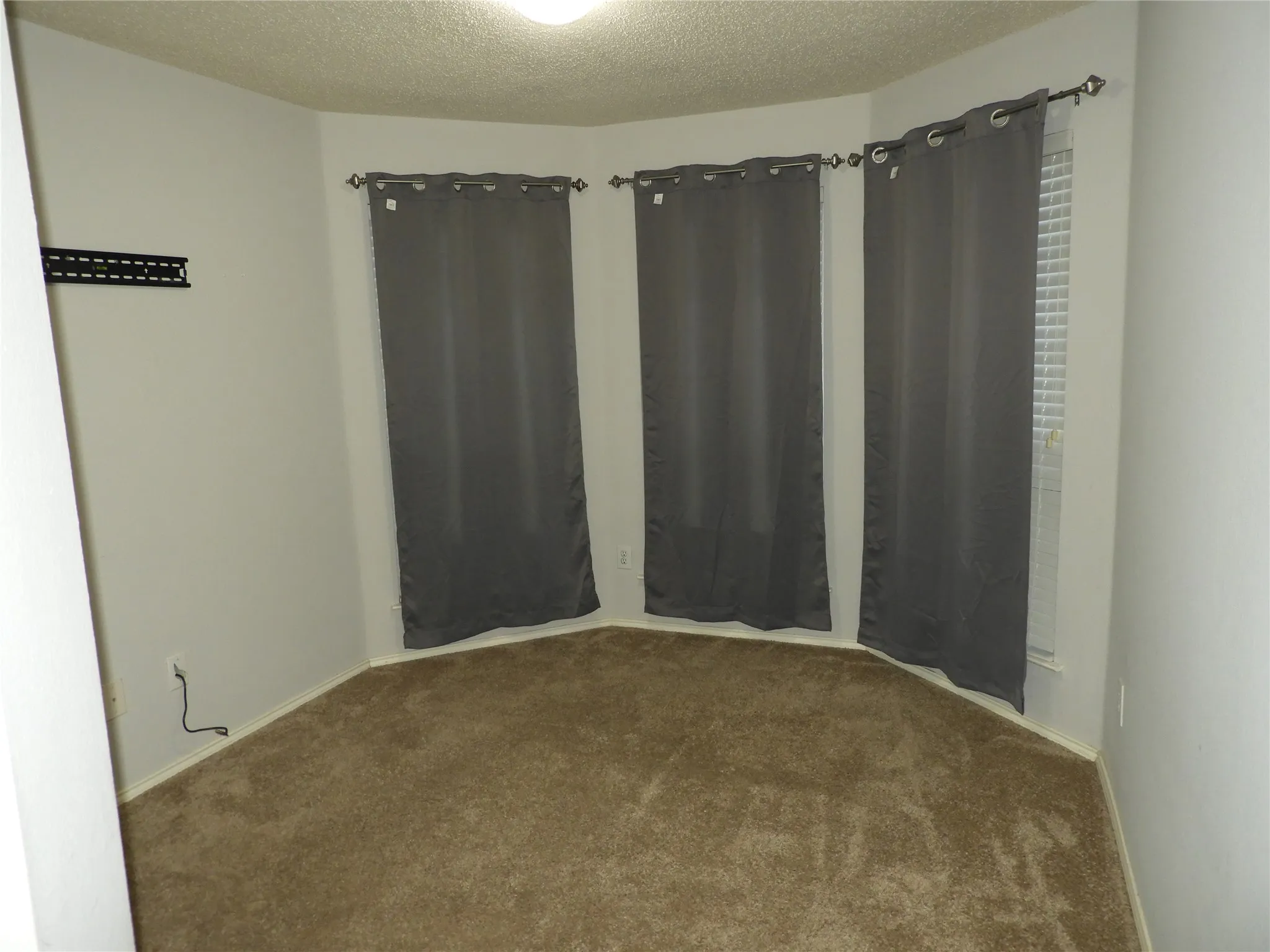 Bedroom #2 with bay windows.