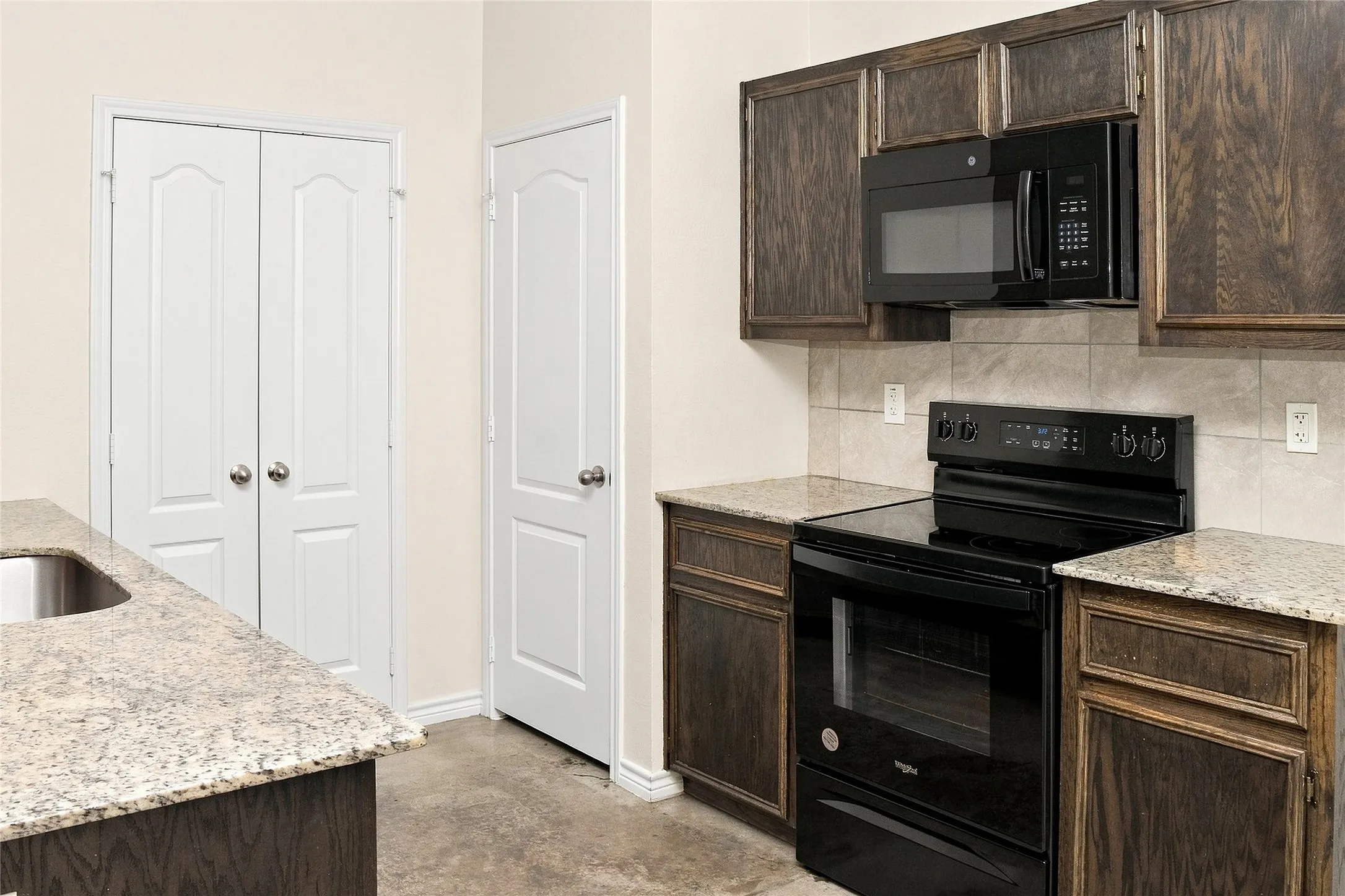 Wood-finish cabinetry paired with light-toned countertops