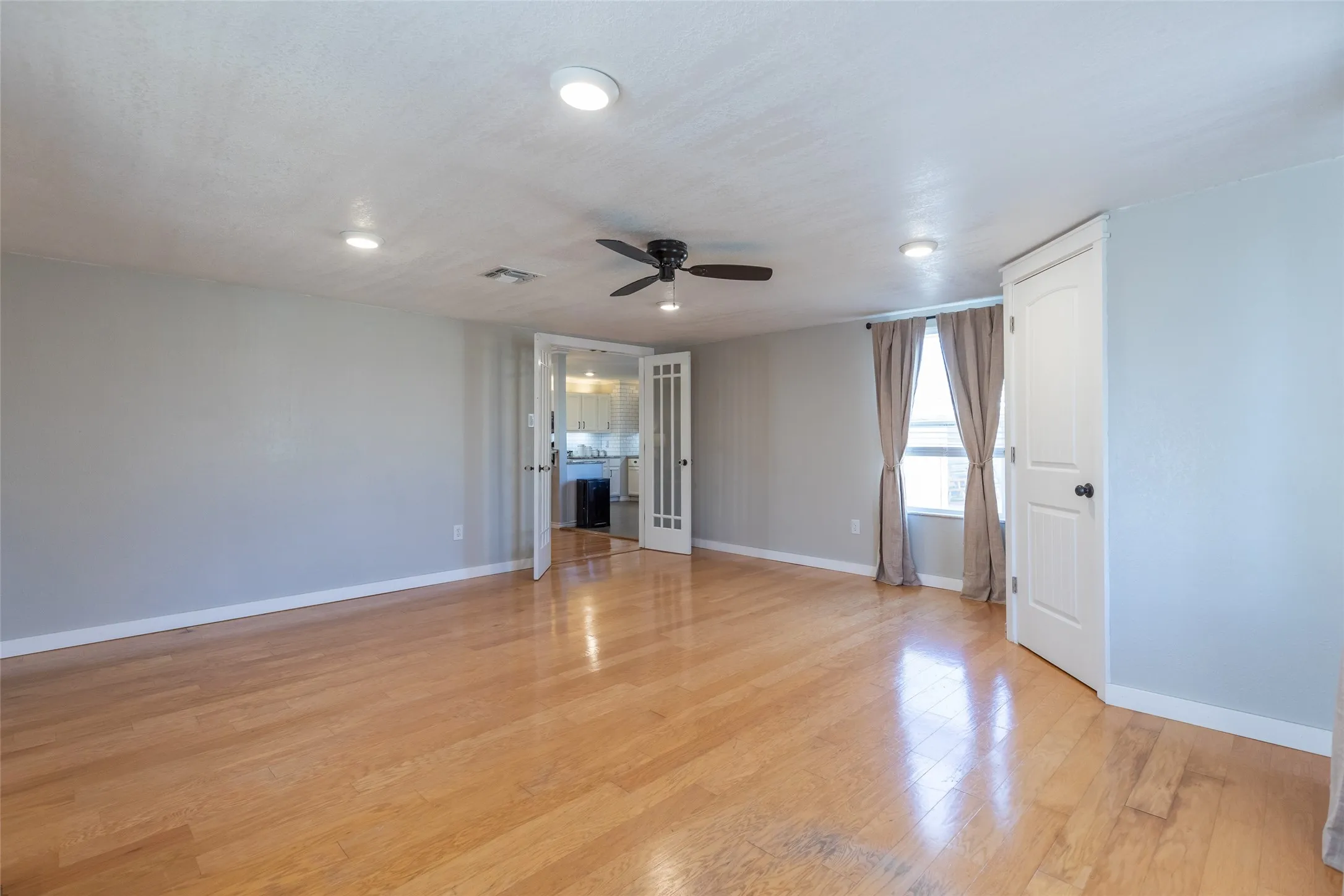 This room features a closet and has both living room and patio access.