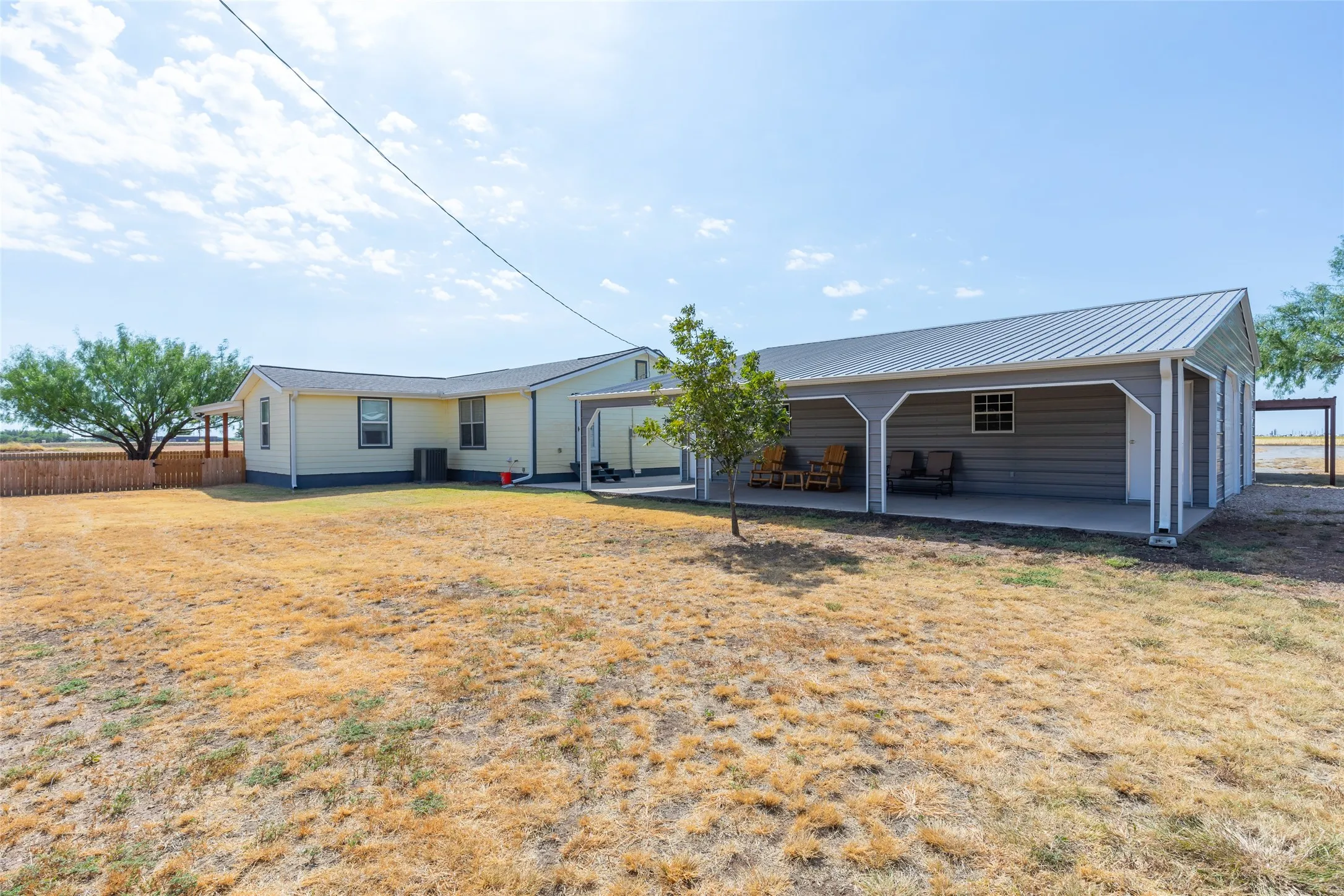 Shop and covered parking adjoins the homes side door entry for convenience.