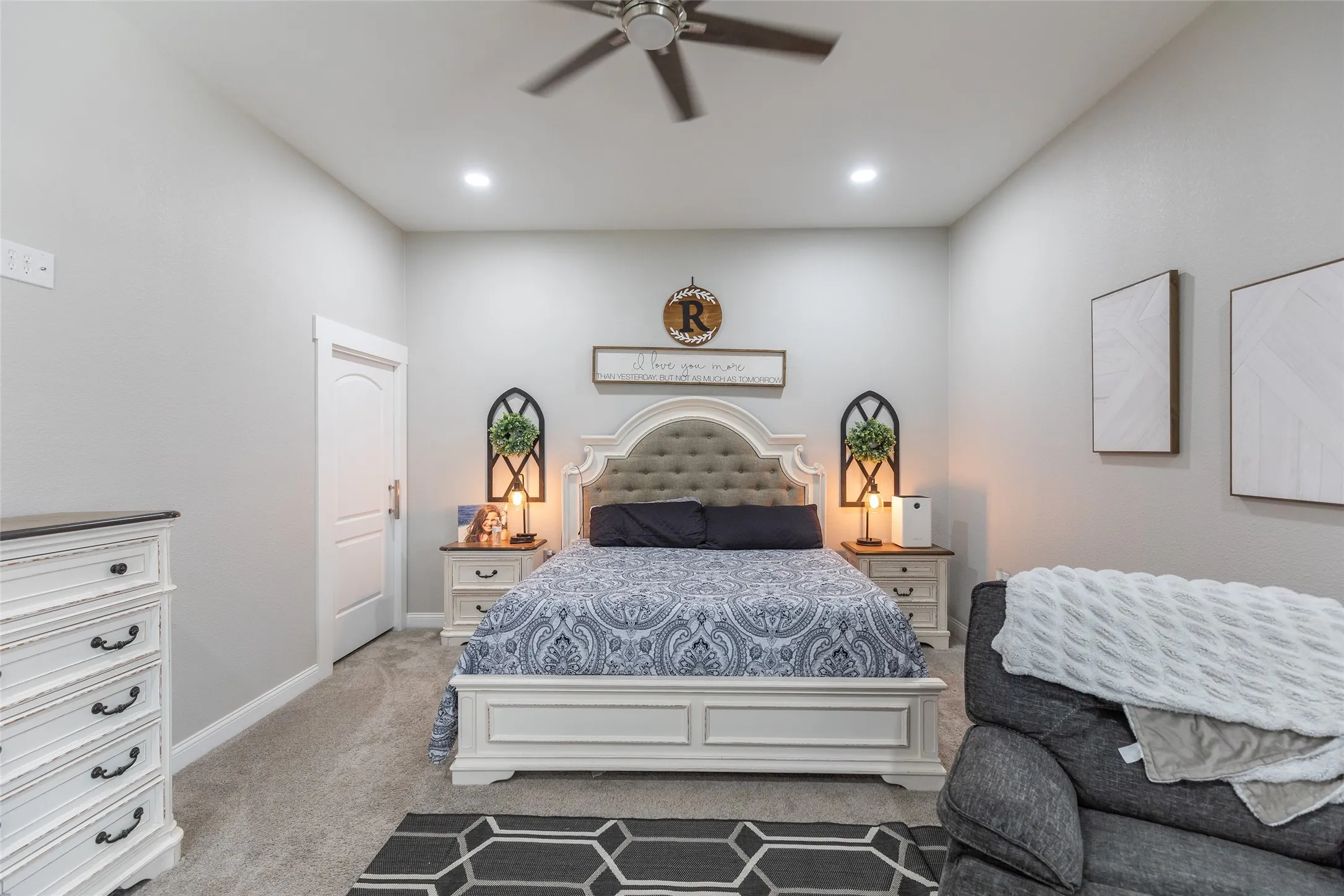 High ceilings with recessed lighting, ceiling fan, and carpeted flooring