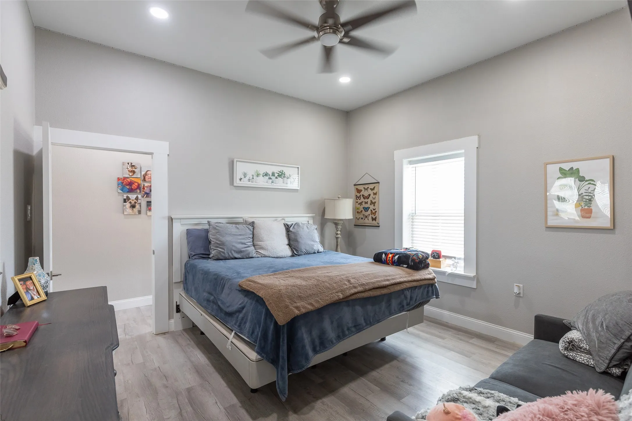 Recessed lighting, ceiling fan, wood-finish flooring, and white trim