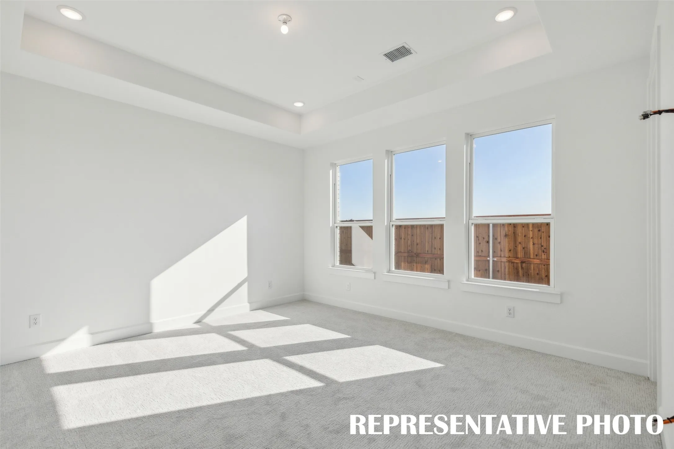 Located at the rear of the home for additional privacy, this dreamy owner's suite was designed for rest and relaxation!  REPRESENTATIVE PHOTO