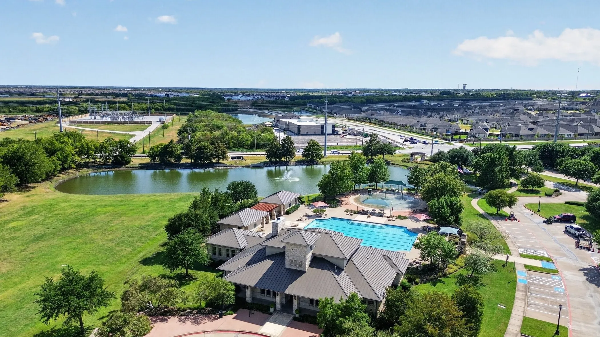 Community recreational building with a large swimming pool, and a children's pool
