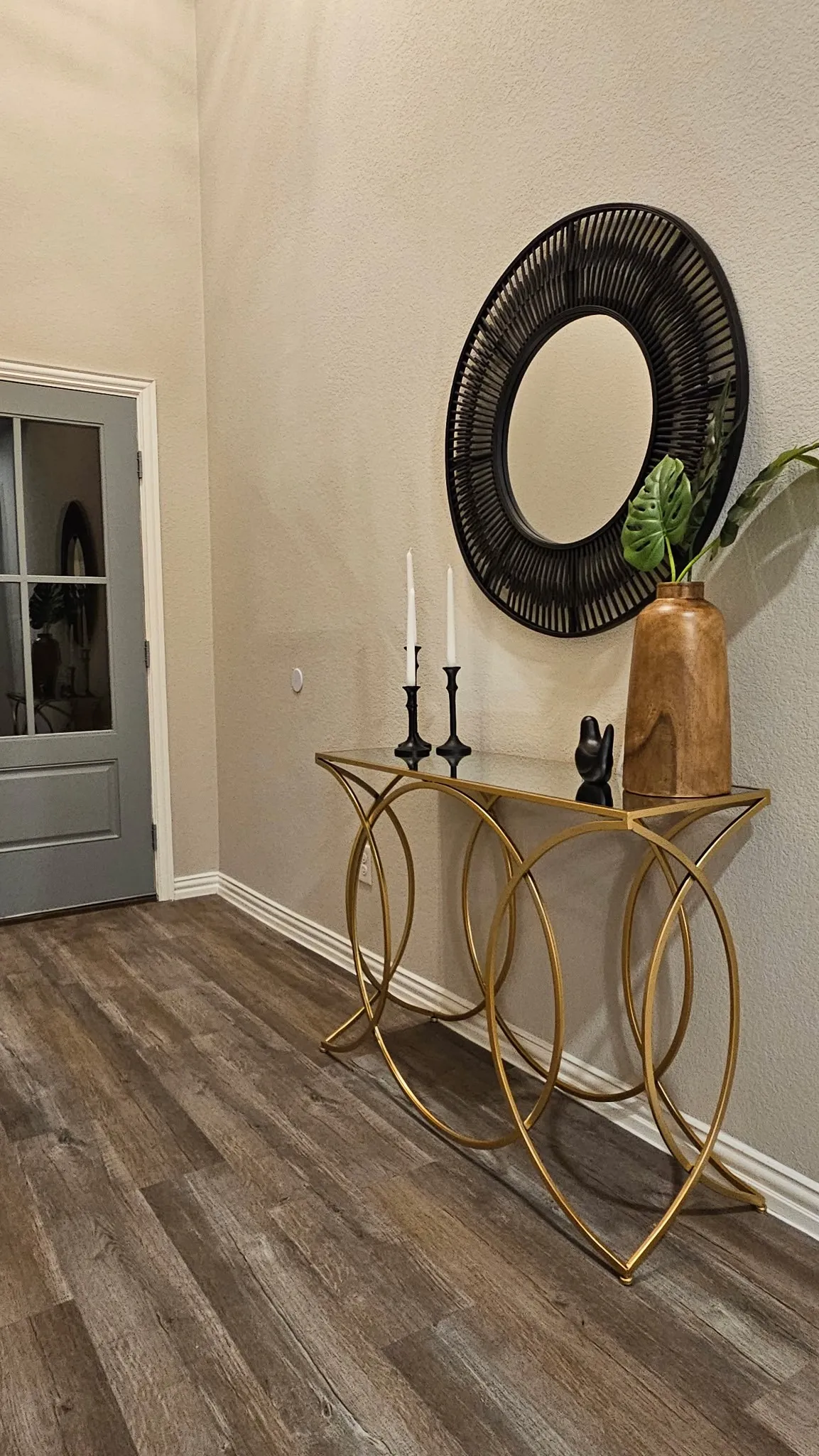 Wood-finish flooring with neutral wall tones and white trim