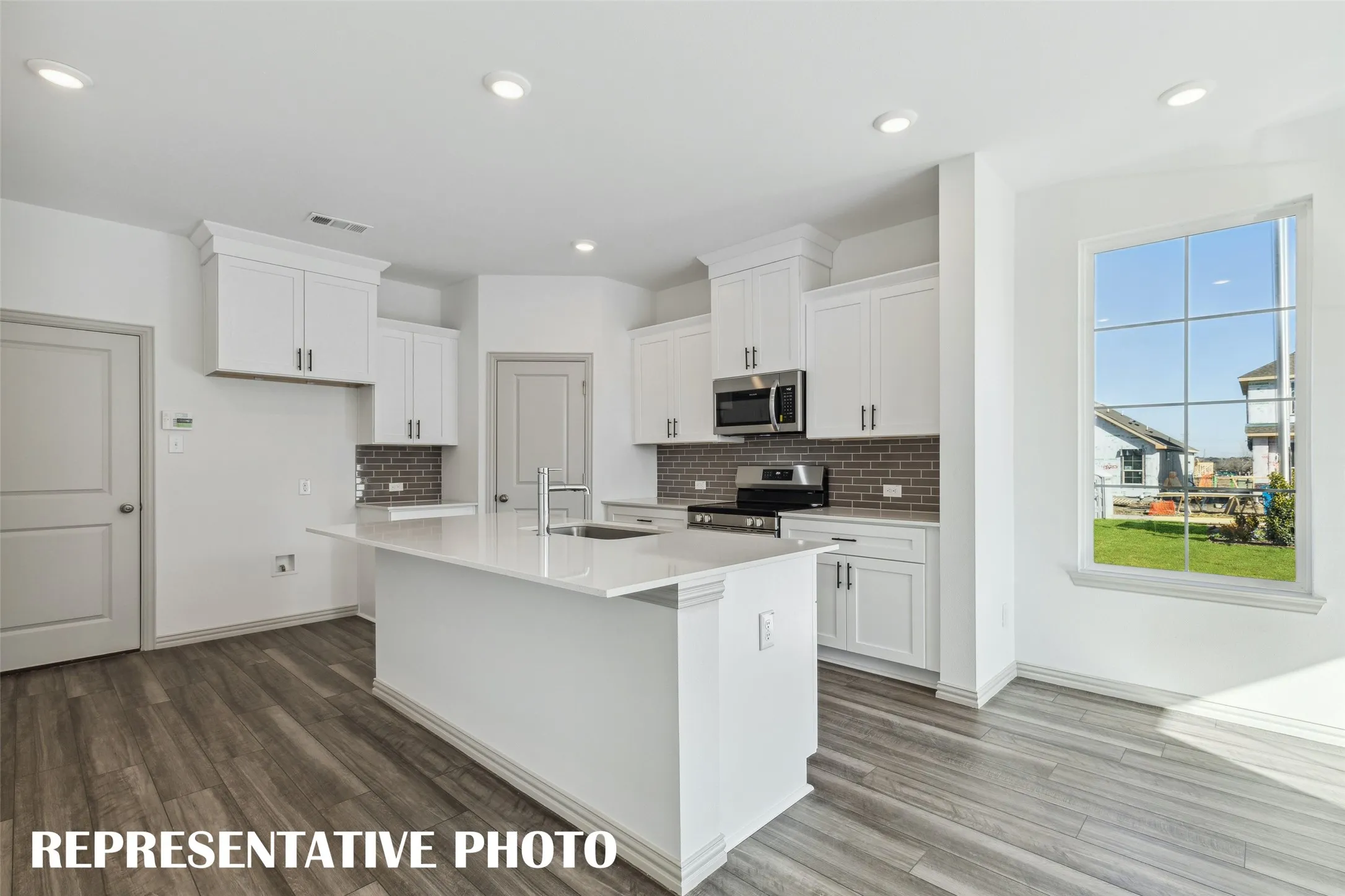 With outstanding storage and prep space, this dream kitchen would make any chef proud to call it their own!  REPRESENTATIVE PHOTO
