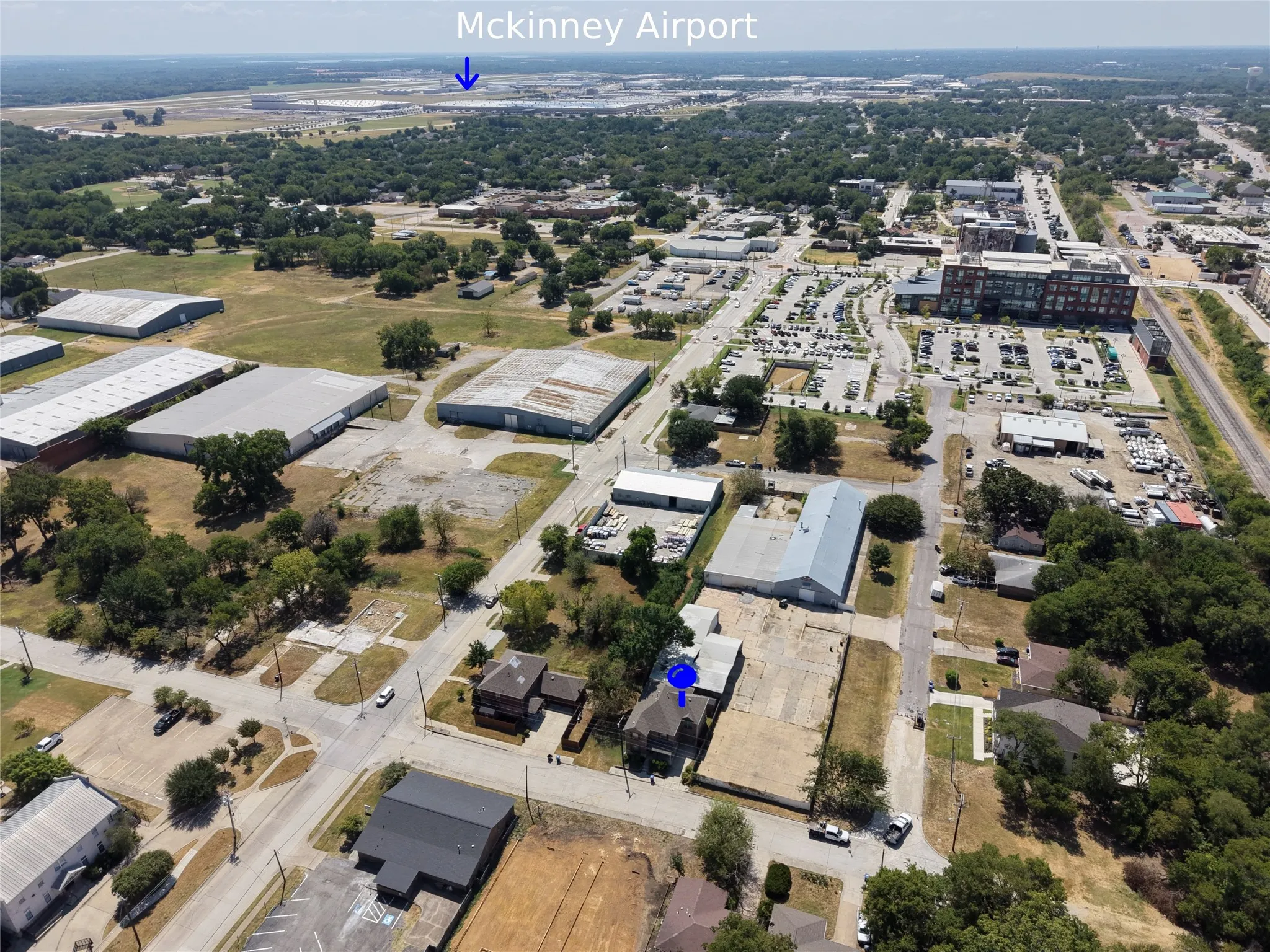Additional contentThis aerial photograph shows the surrounding industrial and commercial area with McKinney Airport marked in the distance