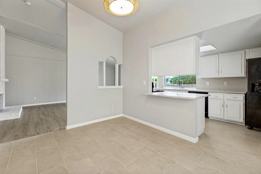 Quartz countertops, and a built-in breakfast bar our conveniently located off the formal dining area