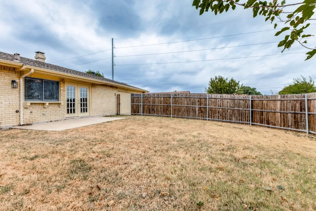Brick exterior with a covered patio