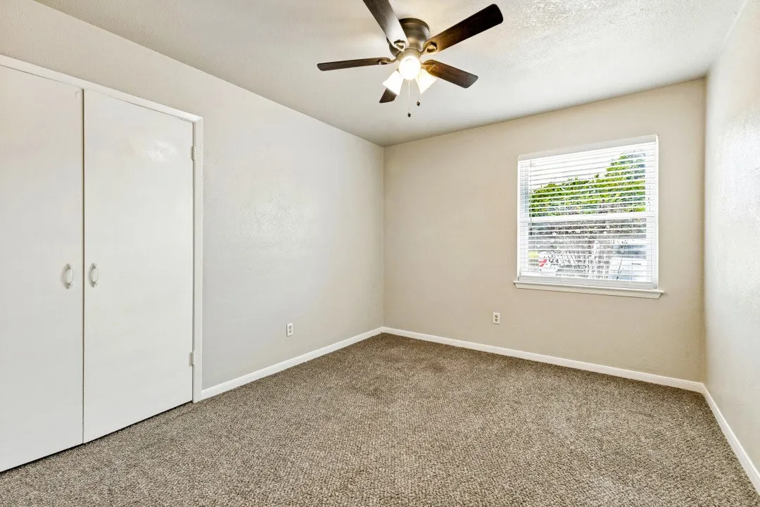 Carpeted interior with neutral wall tones