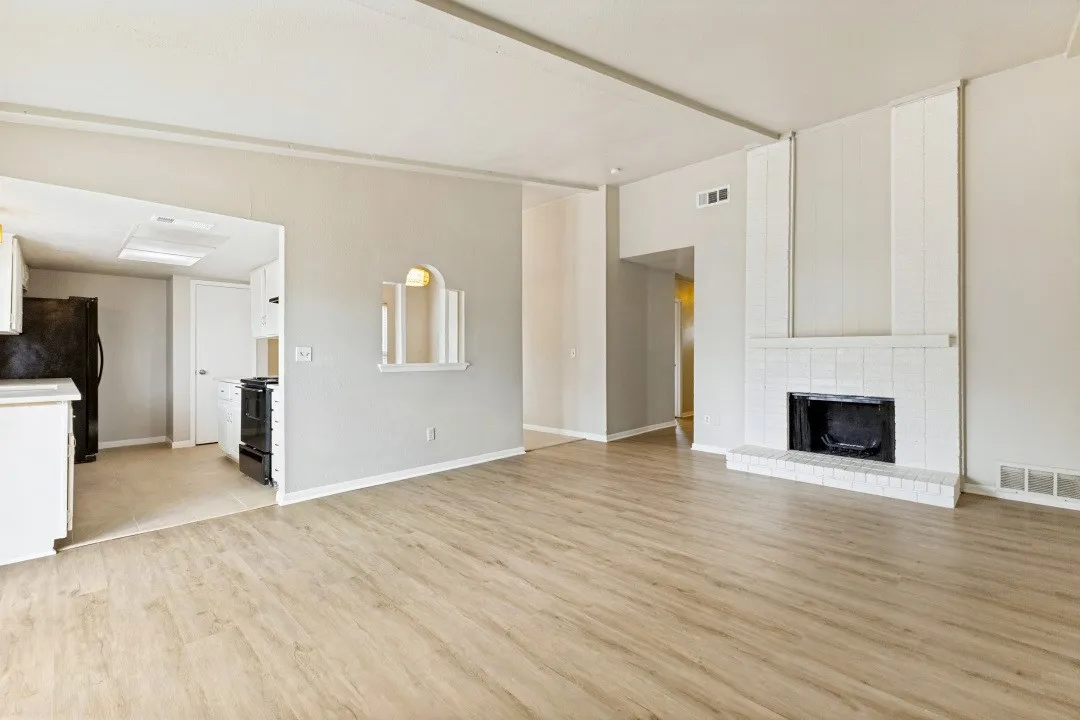 Painted white Cedar beamed ceiling treatment add a special touch to the living room