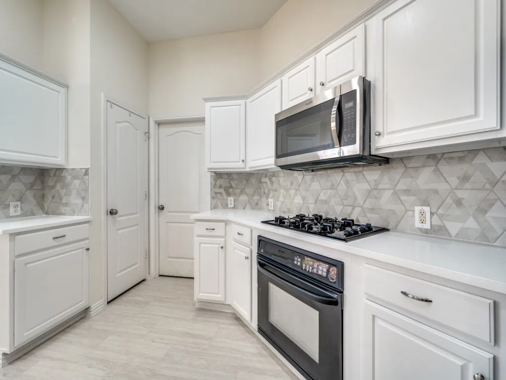 Gas cooktop and oven. Built in microwave. Updated quartz countertops. Built in pantry.