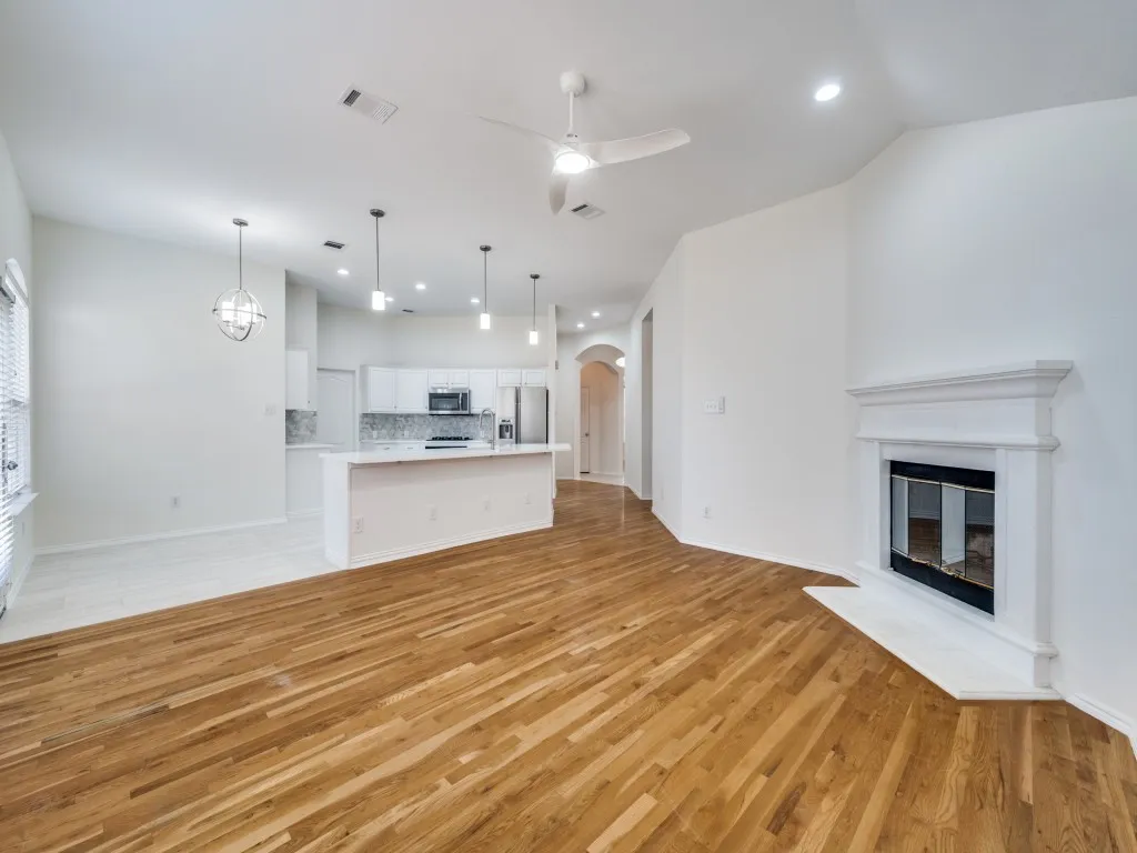 Open living area adjacent to the kitchen and breakfast area. Gas fireplace.  Wood floors-no carpet.