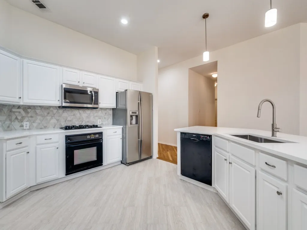 Updated kitchen with quartz countertops. Open style for cooking and entertaining