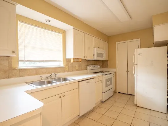 galley kitchen and nice window to see backyard