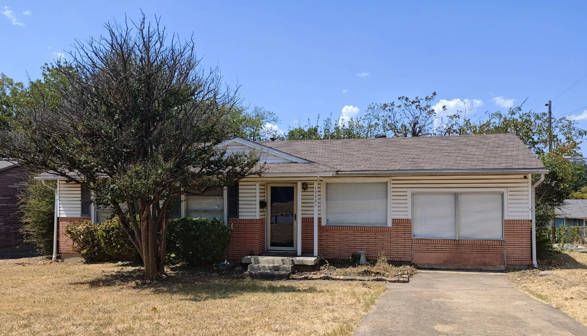 Partial brick and siding exterior with a composition shingle roof