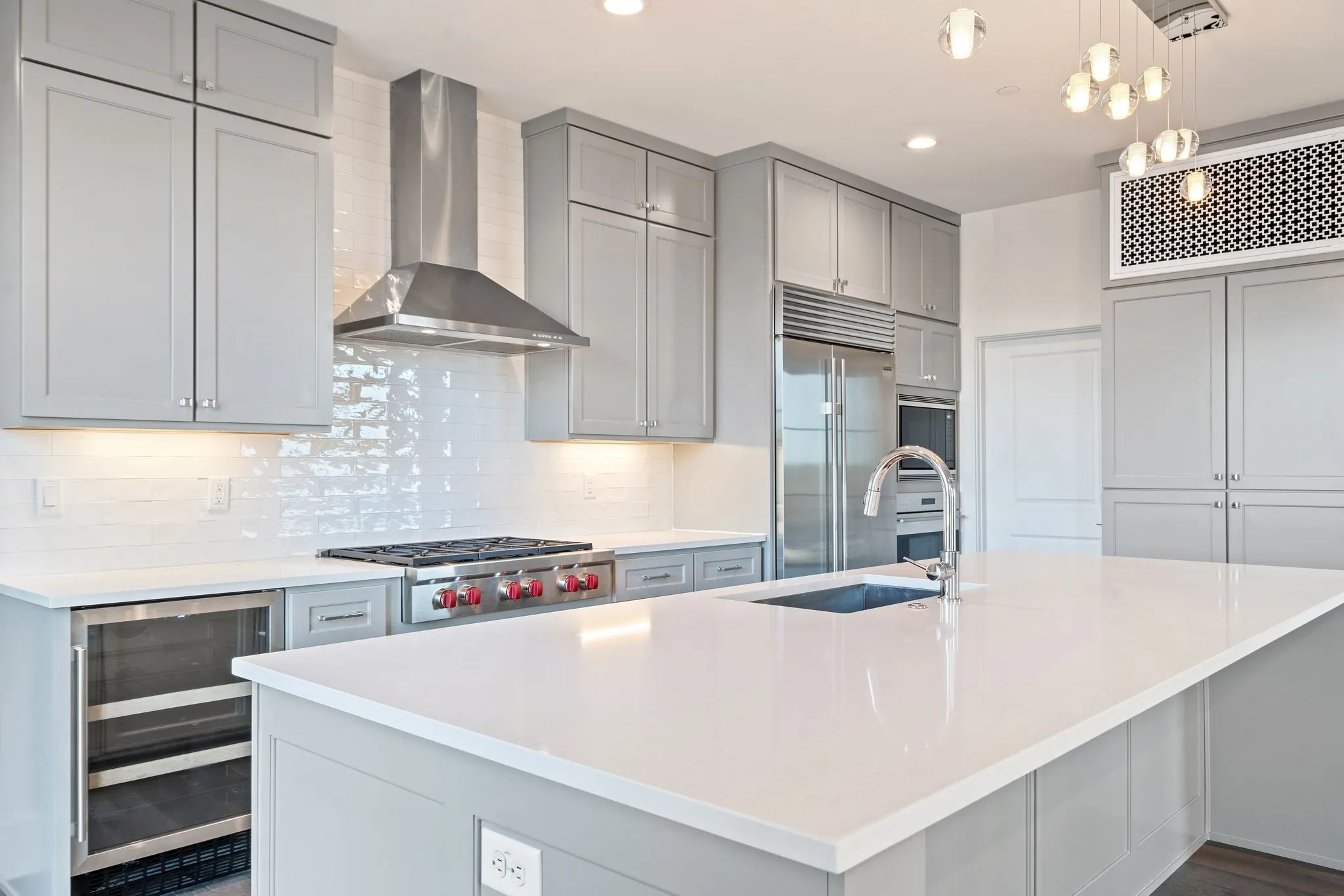 Wolf and Sub-Zero appliances bring professional-grade performance to the beautifully appointed kitchen.