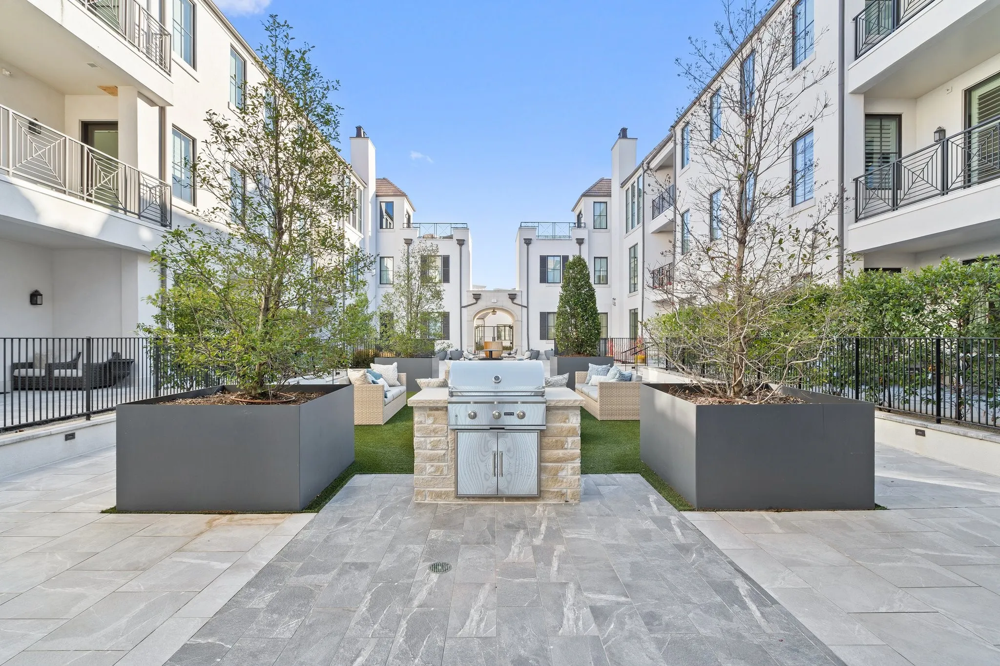Beautifully landscaped courtyards create inviting spaces to gather, dine and unwind.