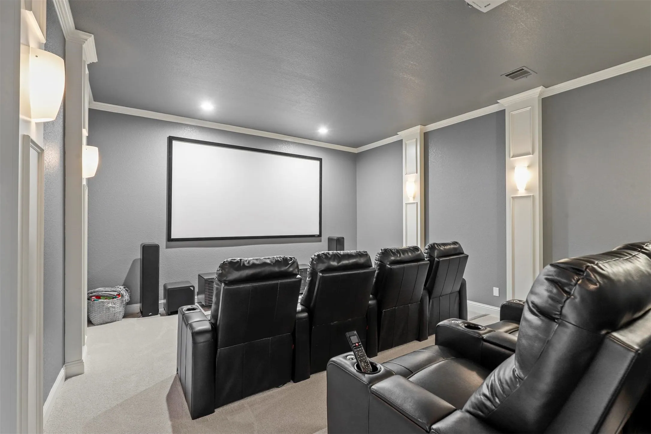 Dedicated media room featuring a large projection screen