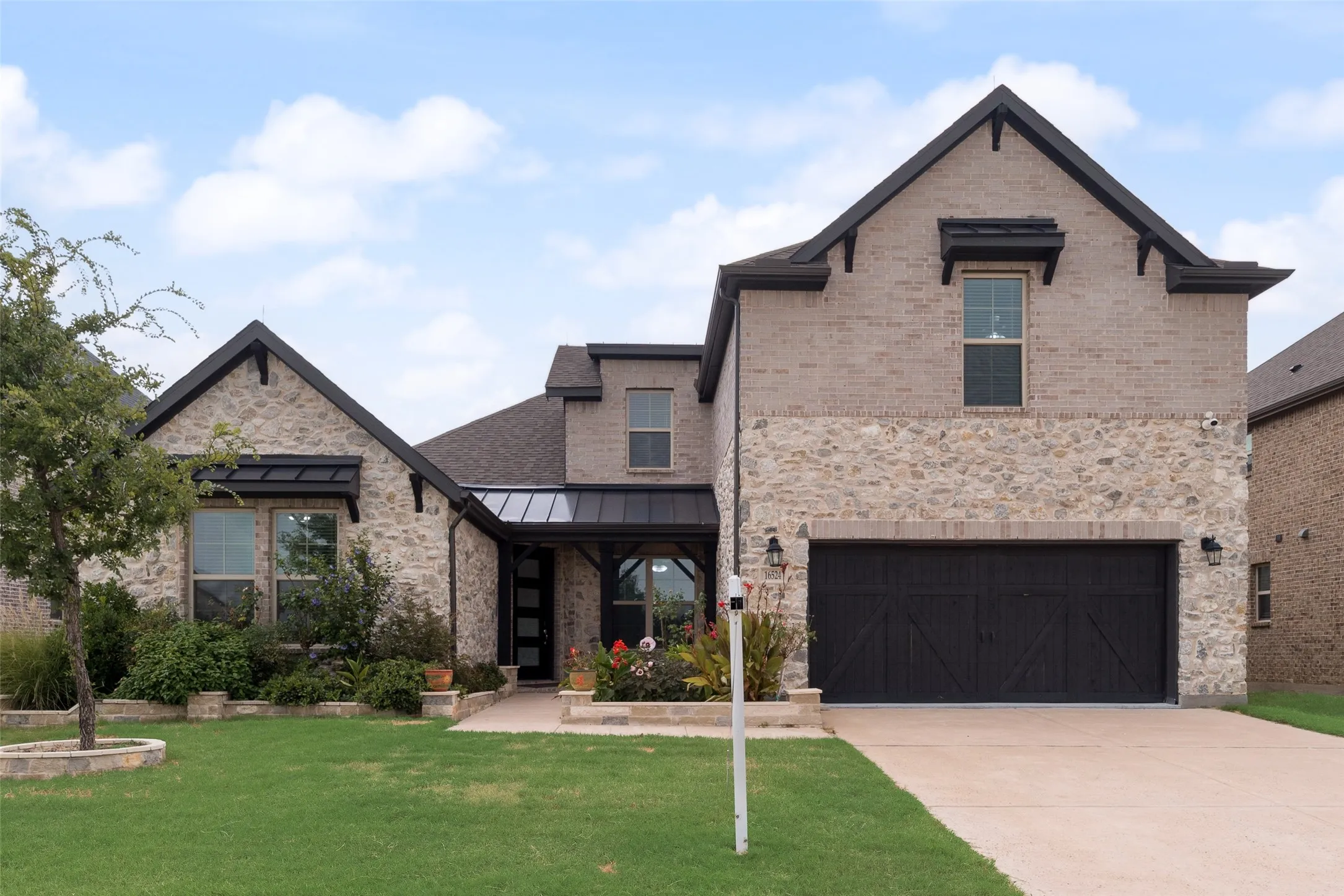 Stone and brick facade with dark trim accents