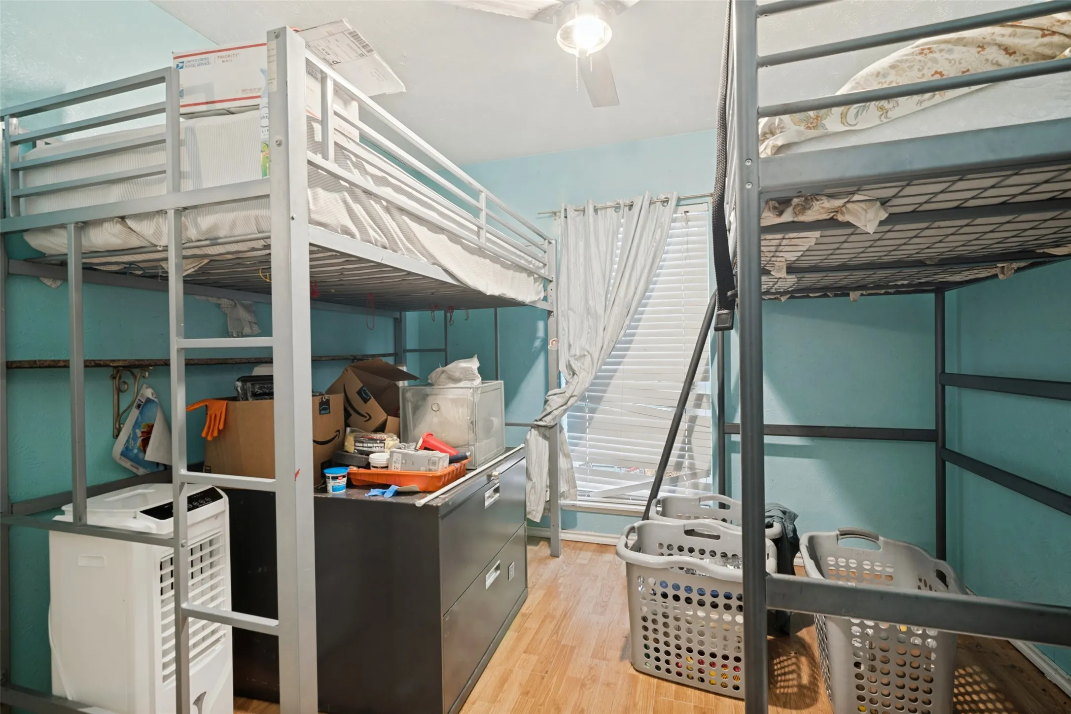 Wood-finish flooring with light blue wall paint