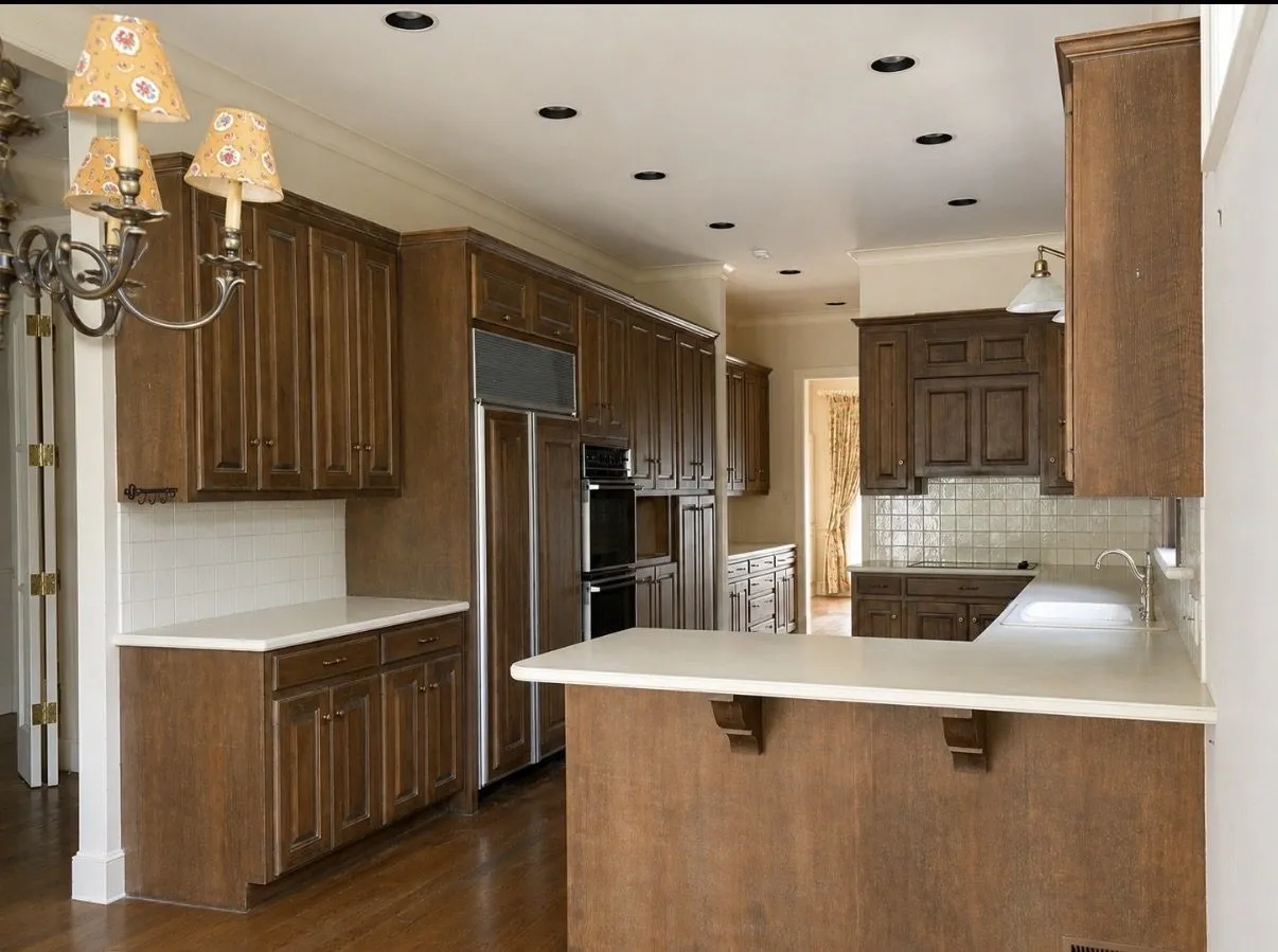Kitchen original from 1991. Numerous cabinets, large walk-in pantry.