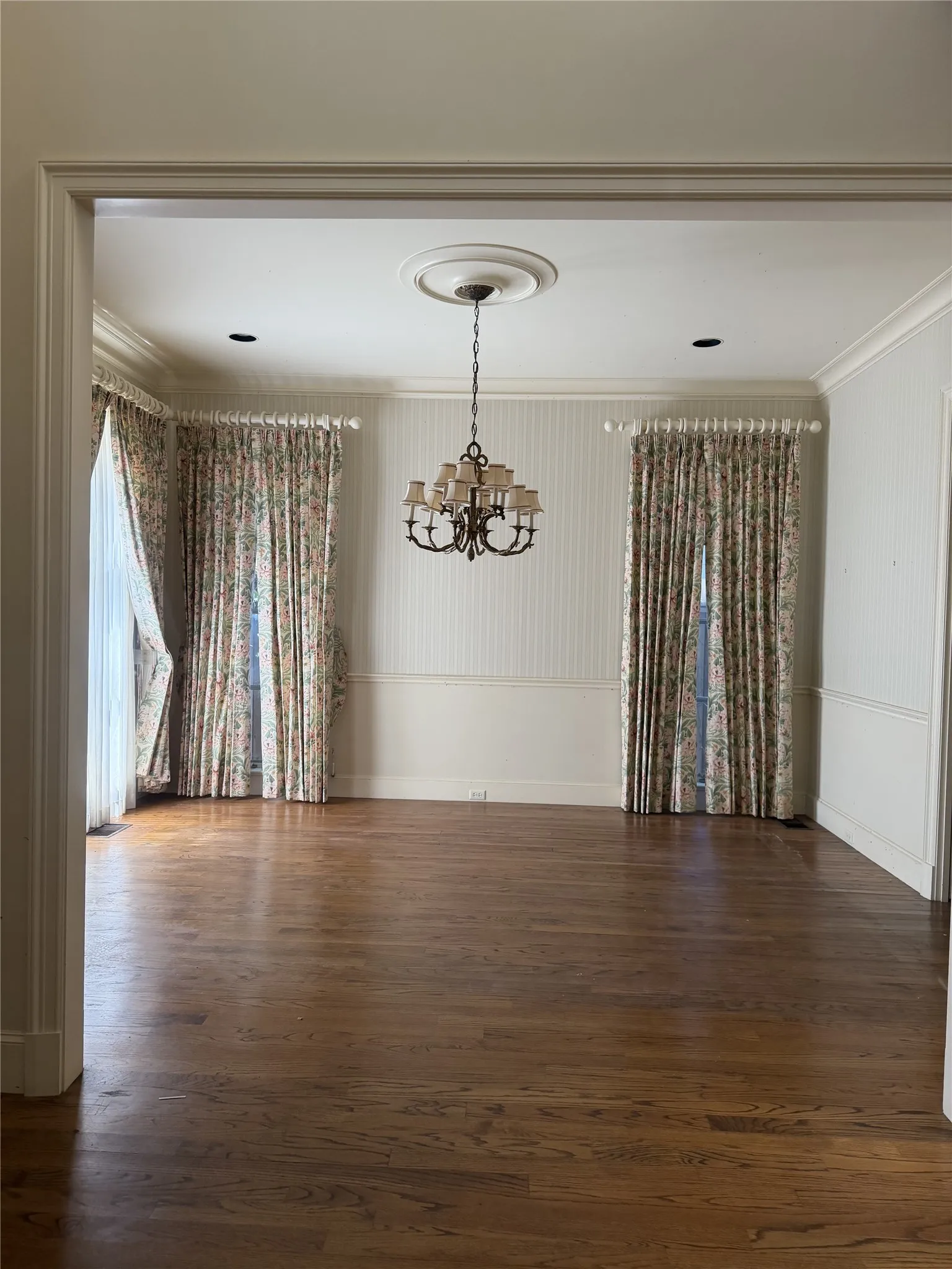 Formal dining directly opposite of living. High ceilings and floor to ceiling windows.