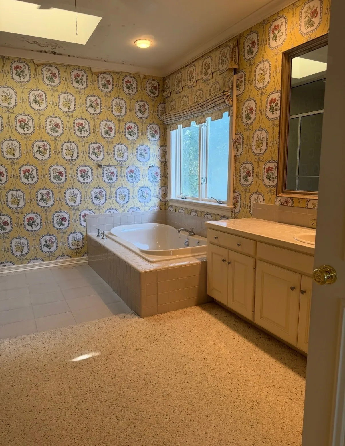 Primary bath with his and hers vanities, separate water closet, large tub and separate shower.