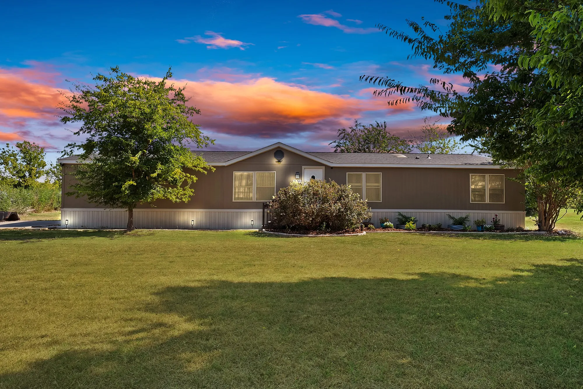 Expansive front yard with mature trees
