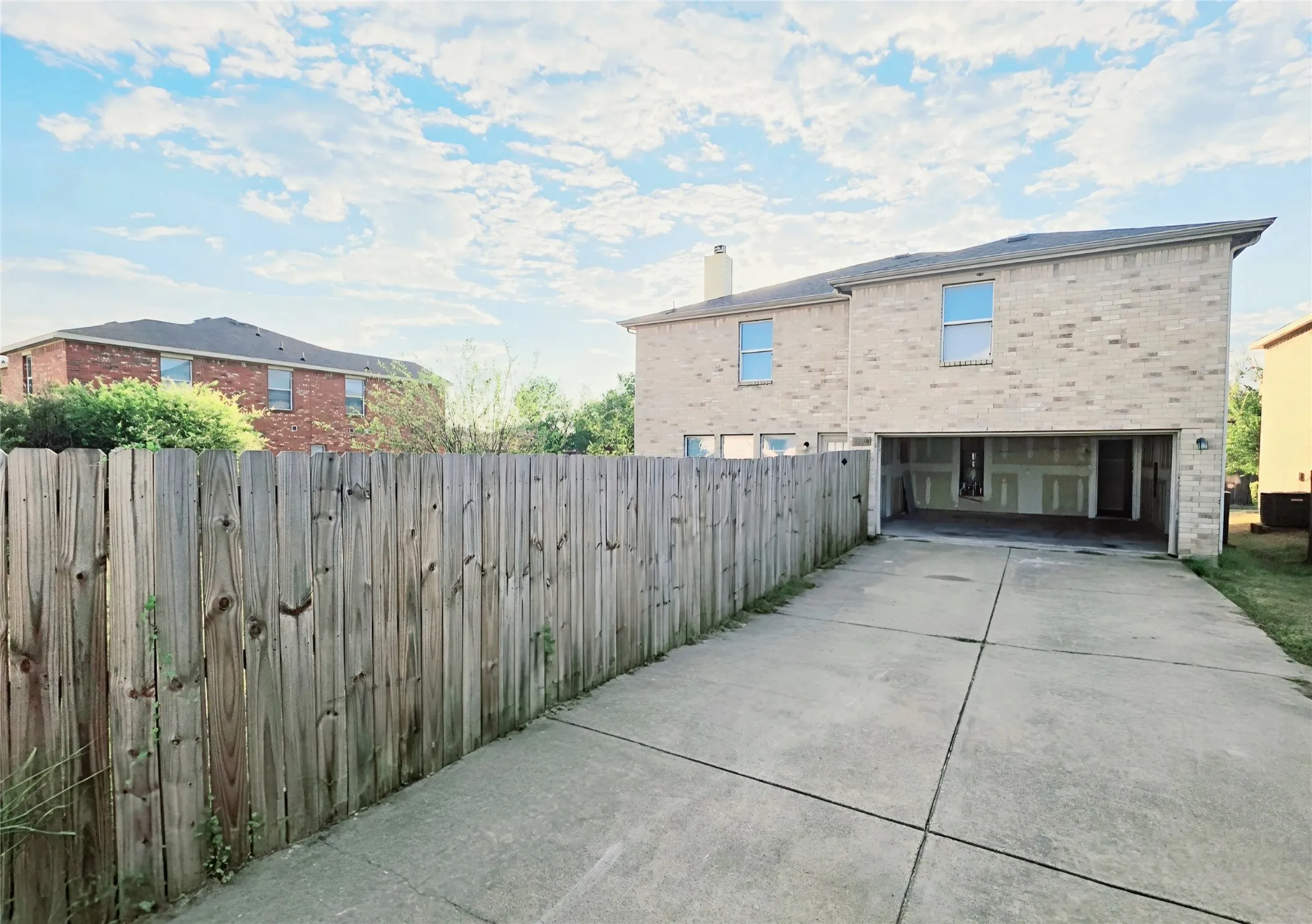 Garage, with extra-long driveway for extra parking spaces.